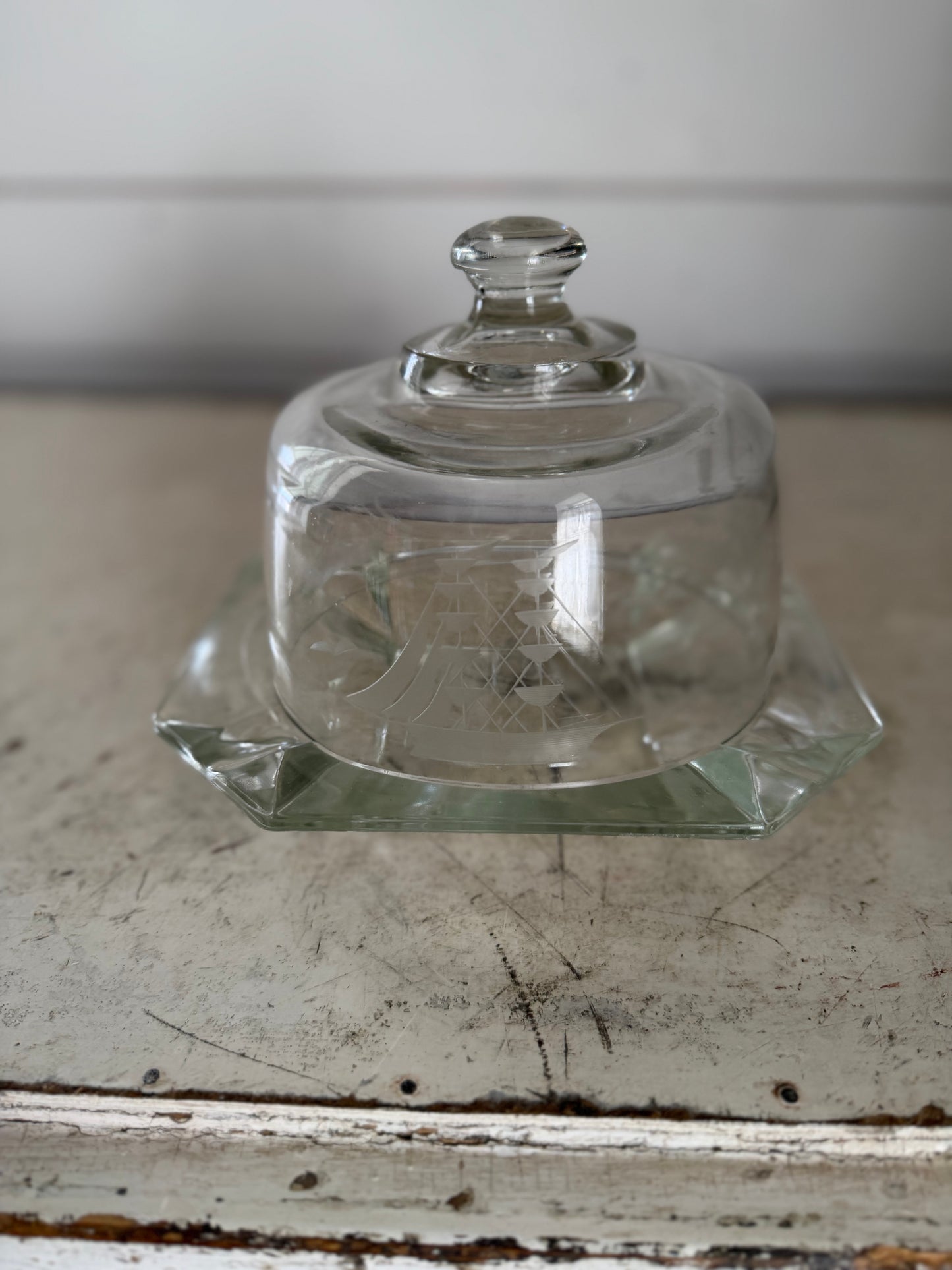 vintage glass dish with a domed lid, featuring a nautical clipper ship etched design