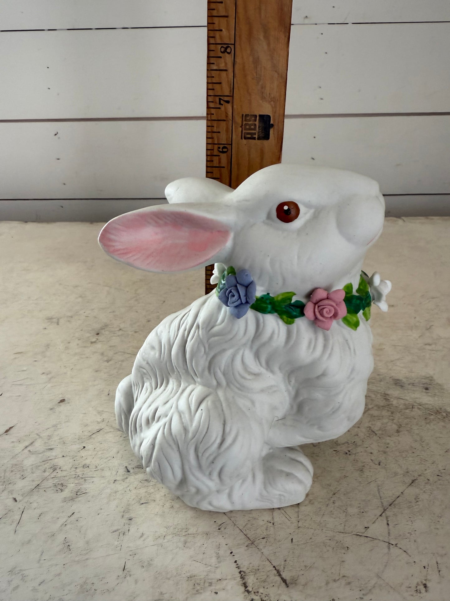 Vintage white rabbit statue with floral wreath  flowers have some chips