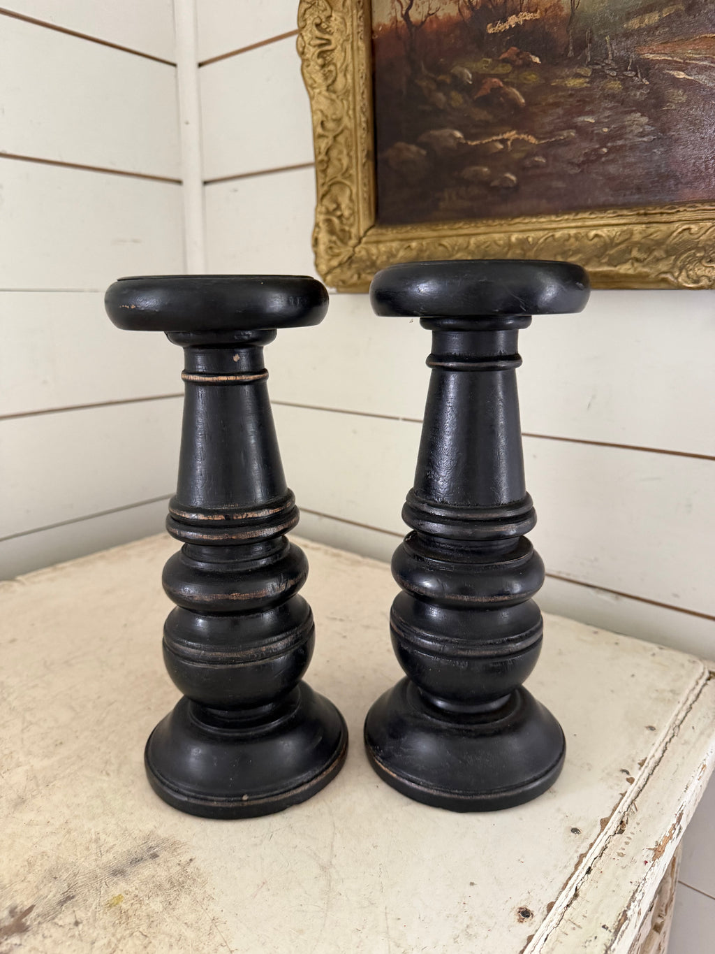 Set of black distress turned candlesticks
