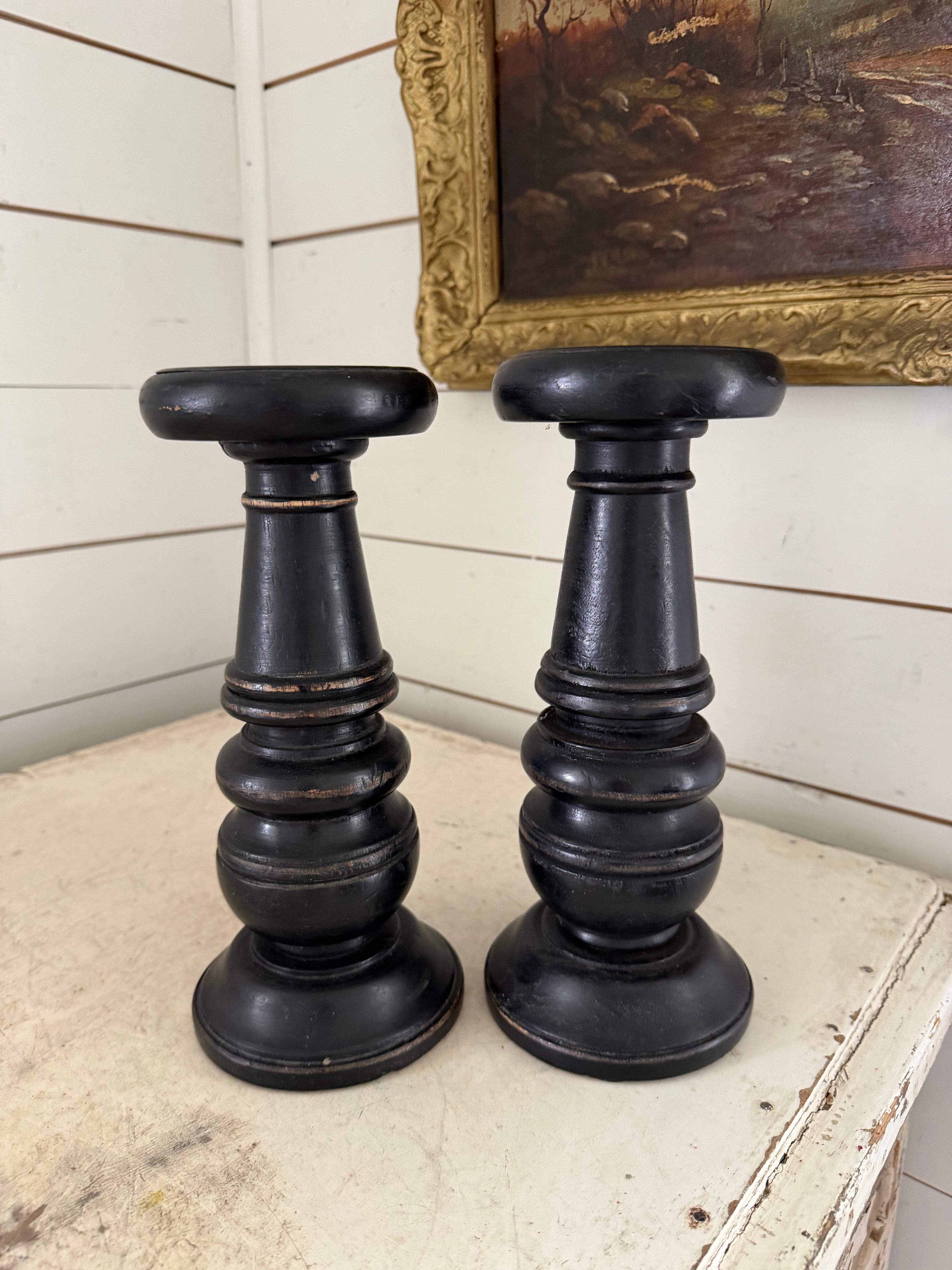 Set of black distress turned candlesticks