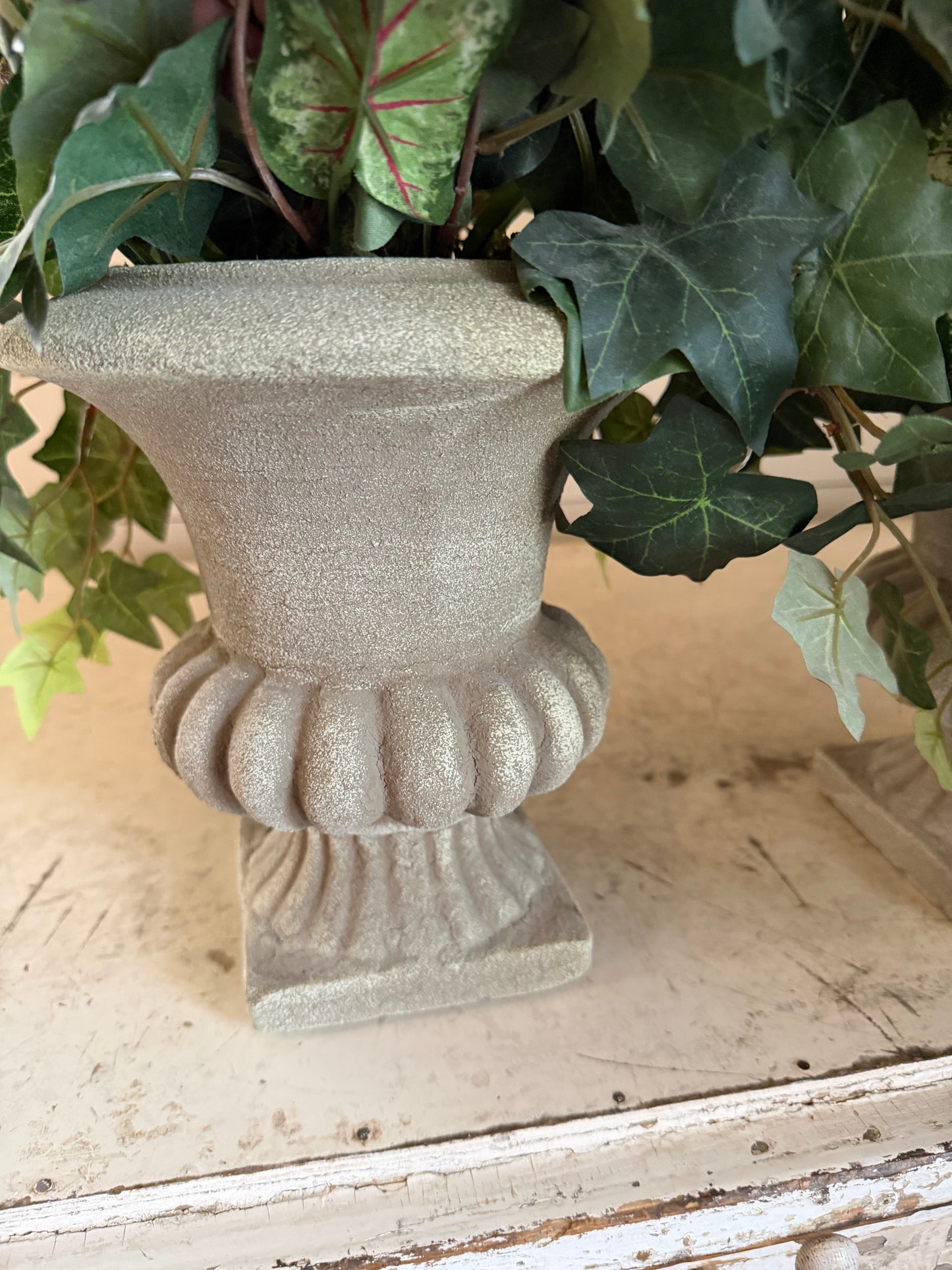 Urns with greenery sold individually