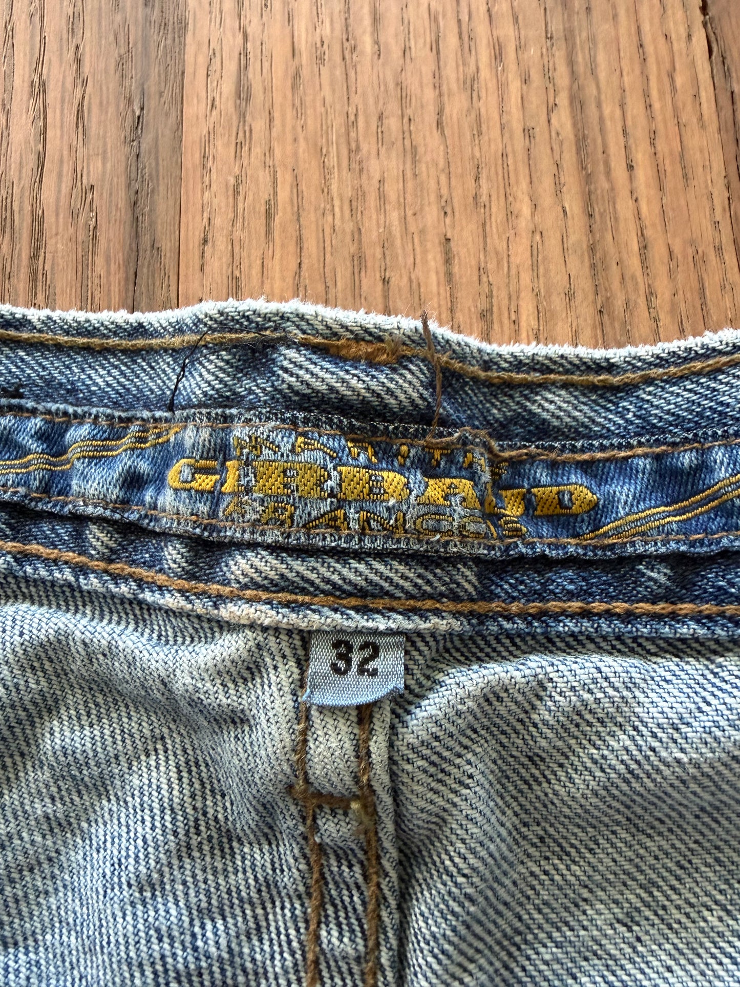90’s vintage Marithé + François Girbaud denim jeans featuring a black brand hangtag on light-wash material 32 cowboy jean new with tag