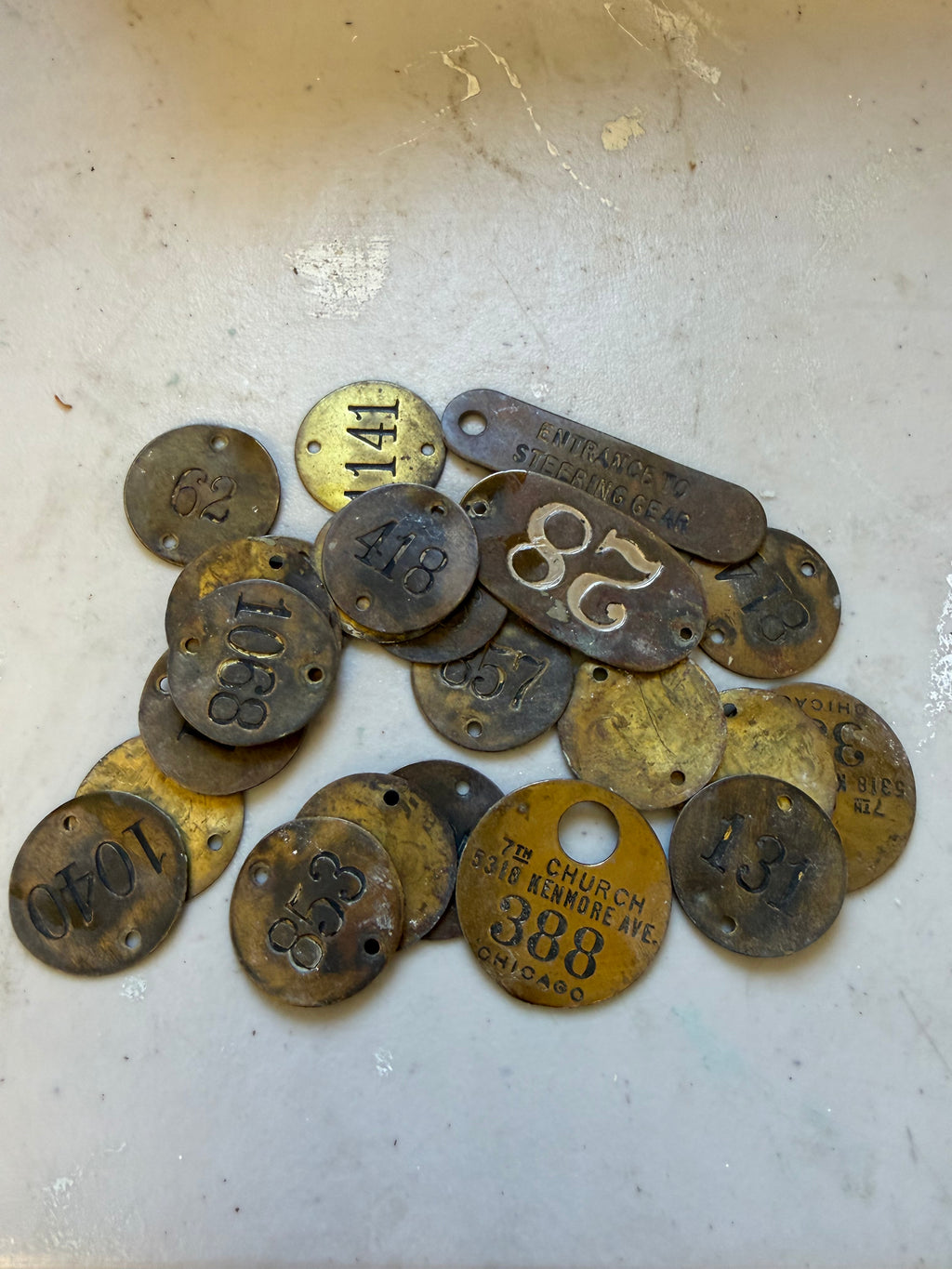Set of 24 vintage brass locker tags