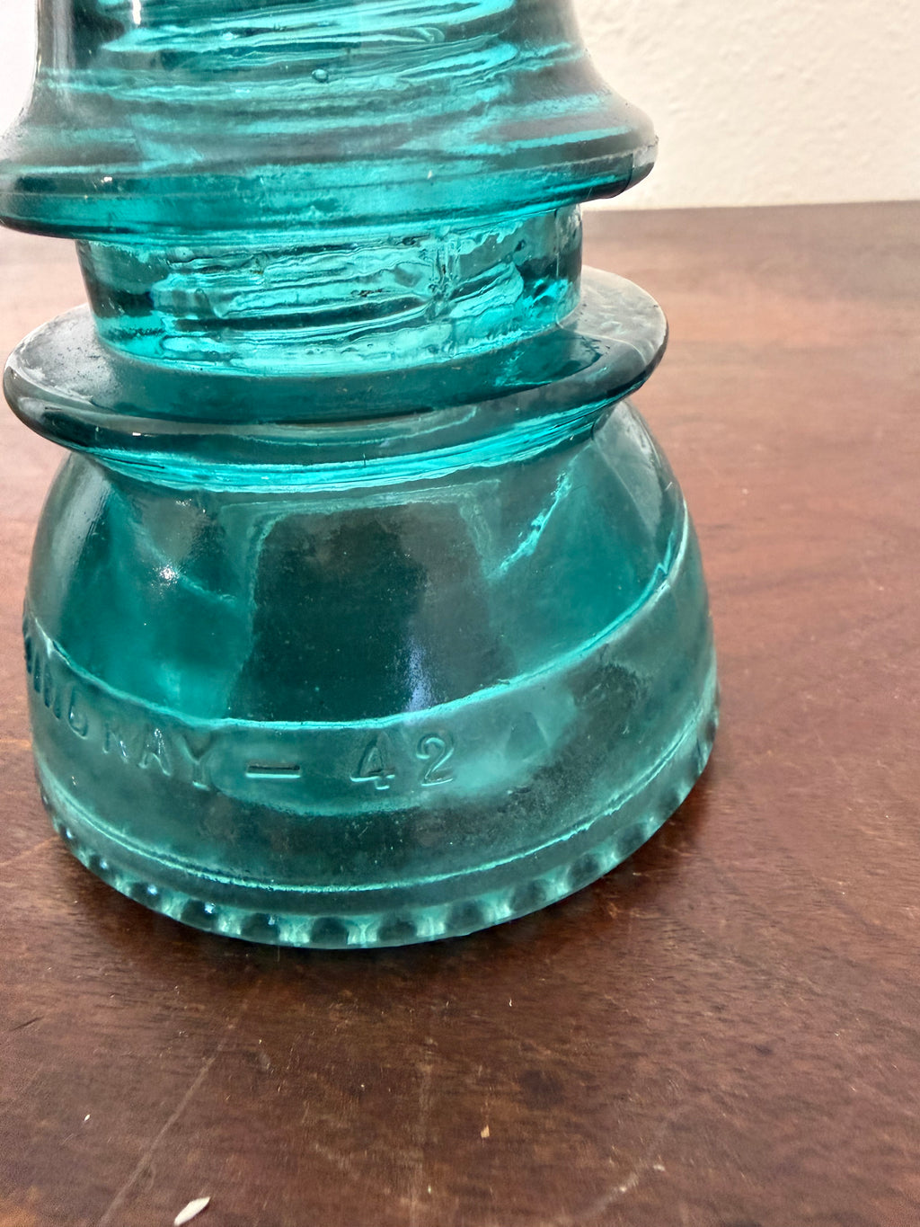 Antique blue green insulator