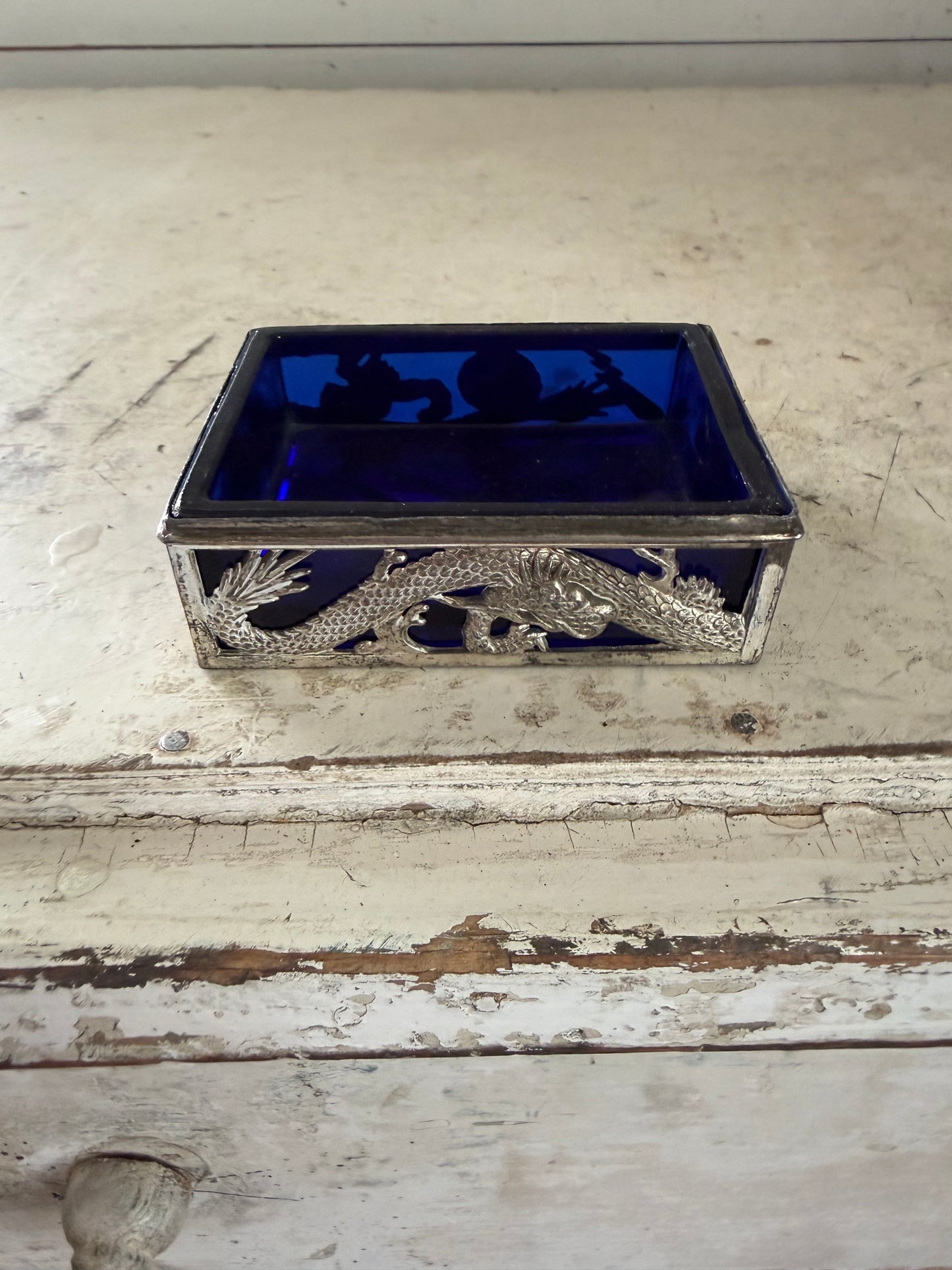 Vintage dragon themed trinket holder with cobalt blue glass insert