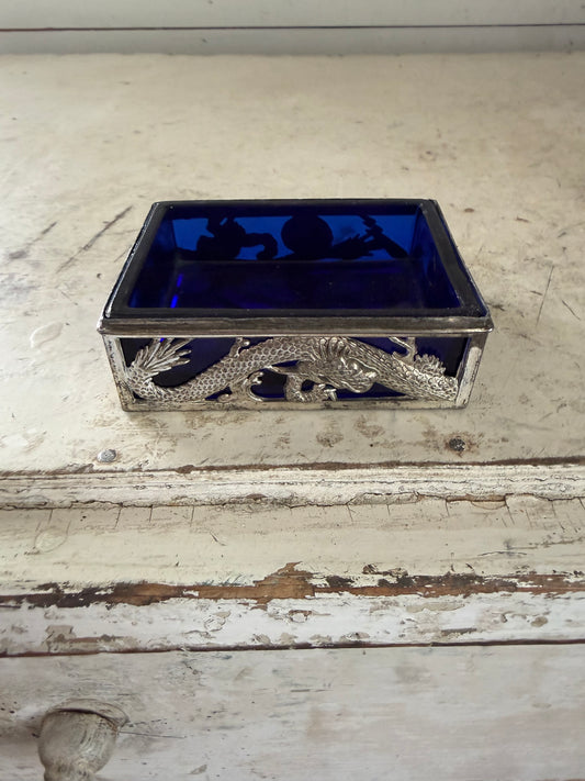 Vintage dragon themed trinket holder with cobalt blue glass insert