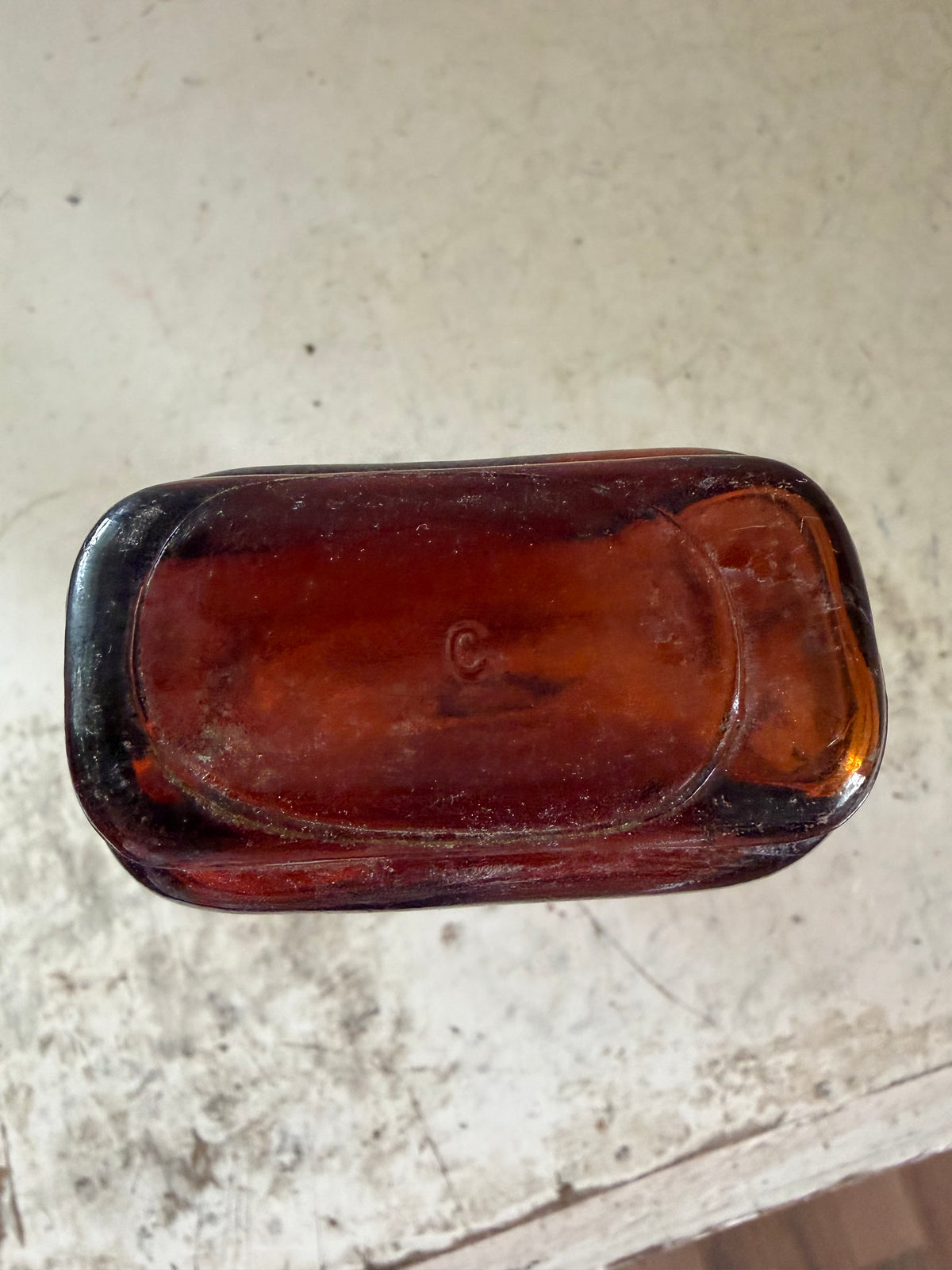 Antique Amber cork stop bottle with decorative seams on the sides