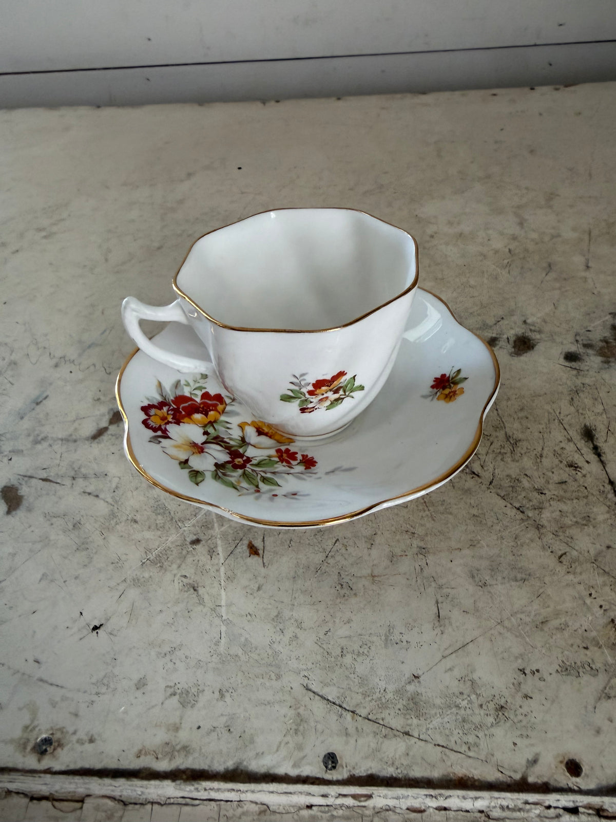 Vintage bone china teacup and saucer set with an octagonal cup