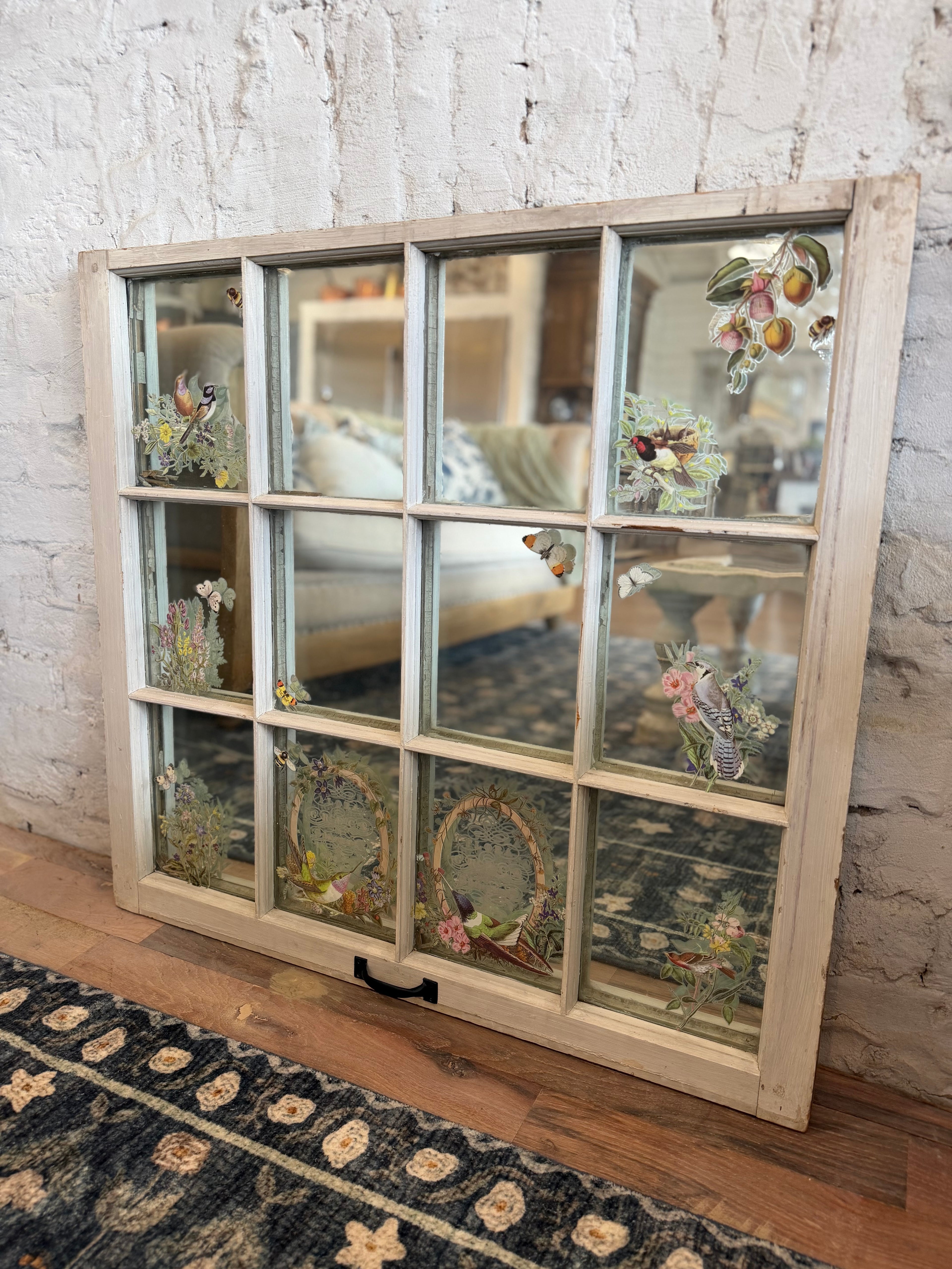 Window with old glass and mirror behind