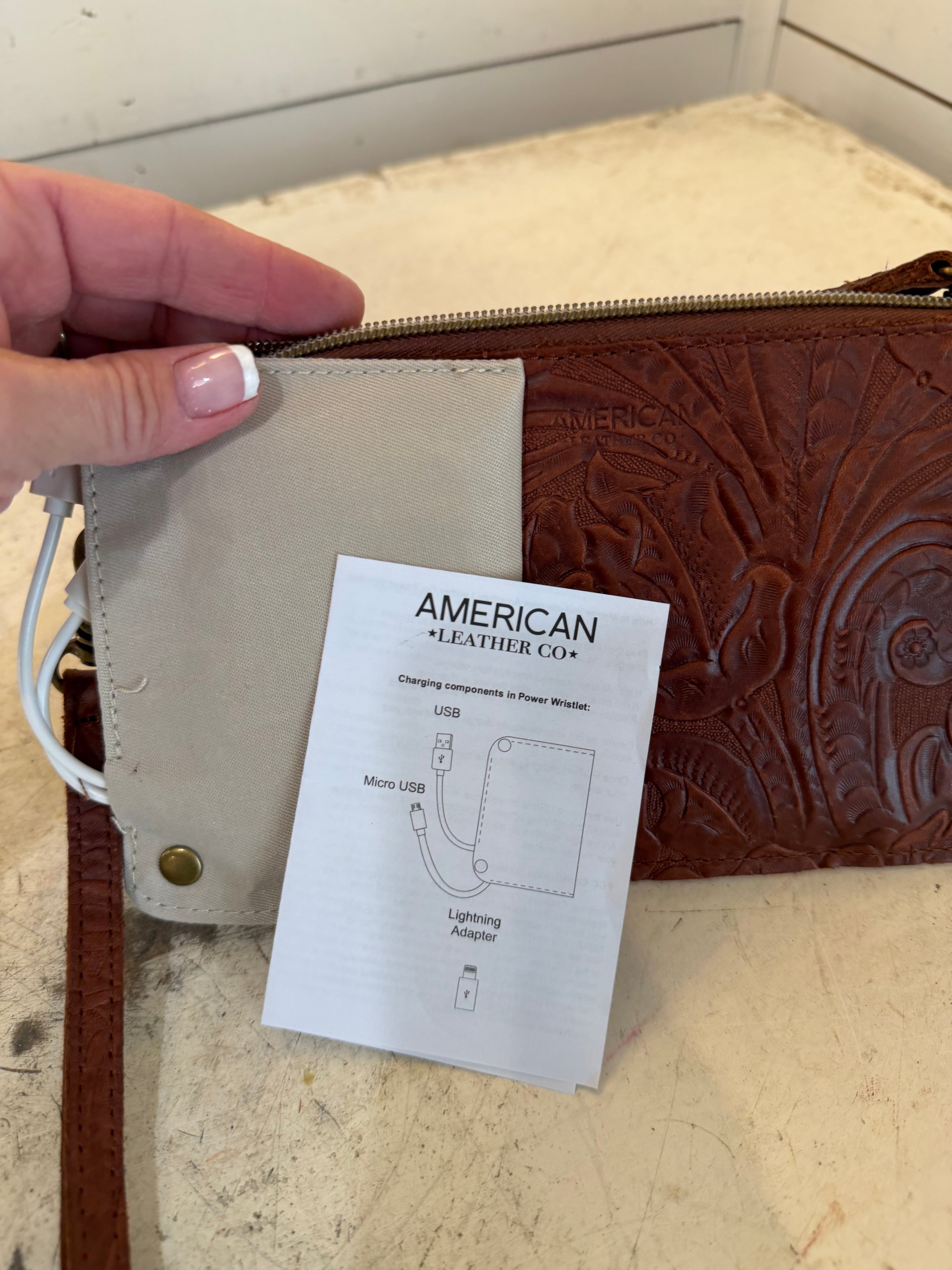 American Leather Co Leather floral embossed essential power wristlet
