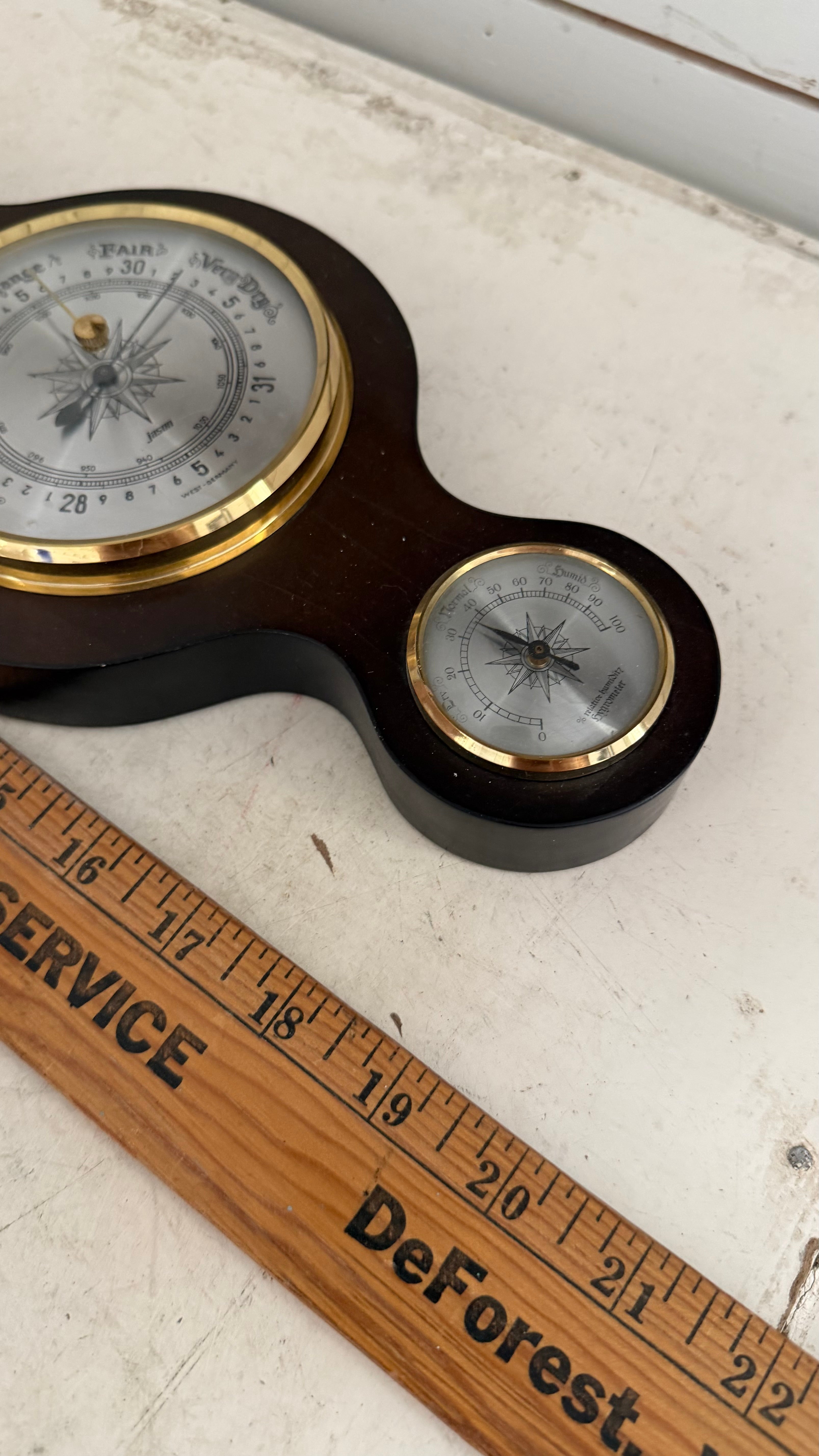 vintage German-made banjo-style weather station features a dark mahogany wood base, a barometer, a thermometer, and a hygrometer as is