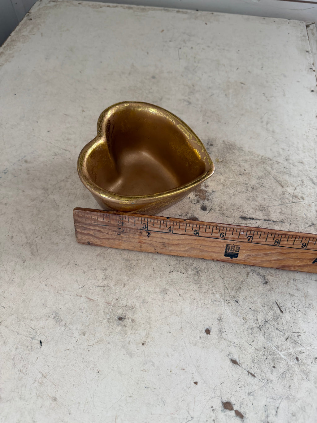 Gold colored heart shaped trinket bowl