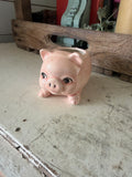 Ceramic pig planter has small chip
