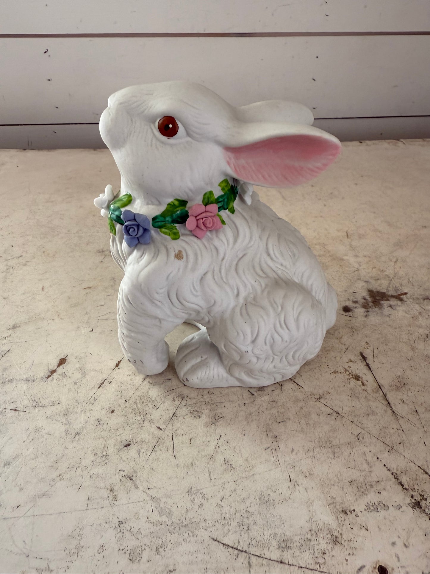 Vintage white rabbit statue with floral wreath  flowers have some chips