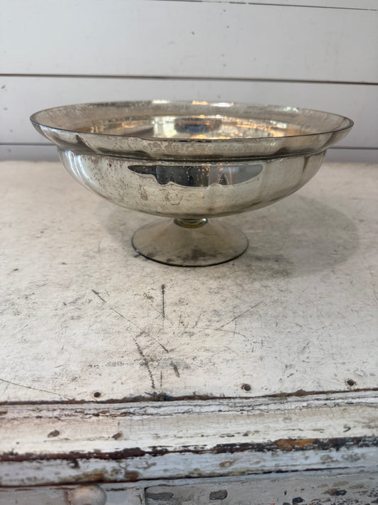 Mercury glass pedestal bowl has a small chip