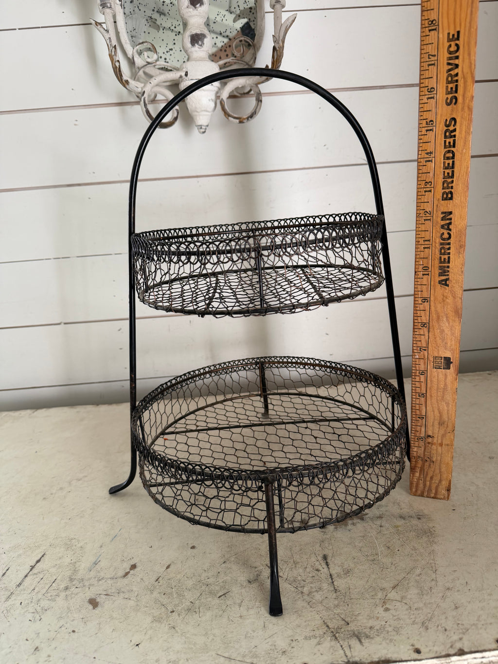 Black 2-tier wire basket with rustic chicken-wire mesh