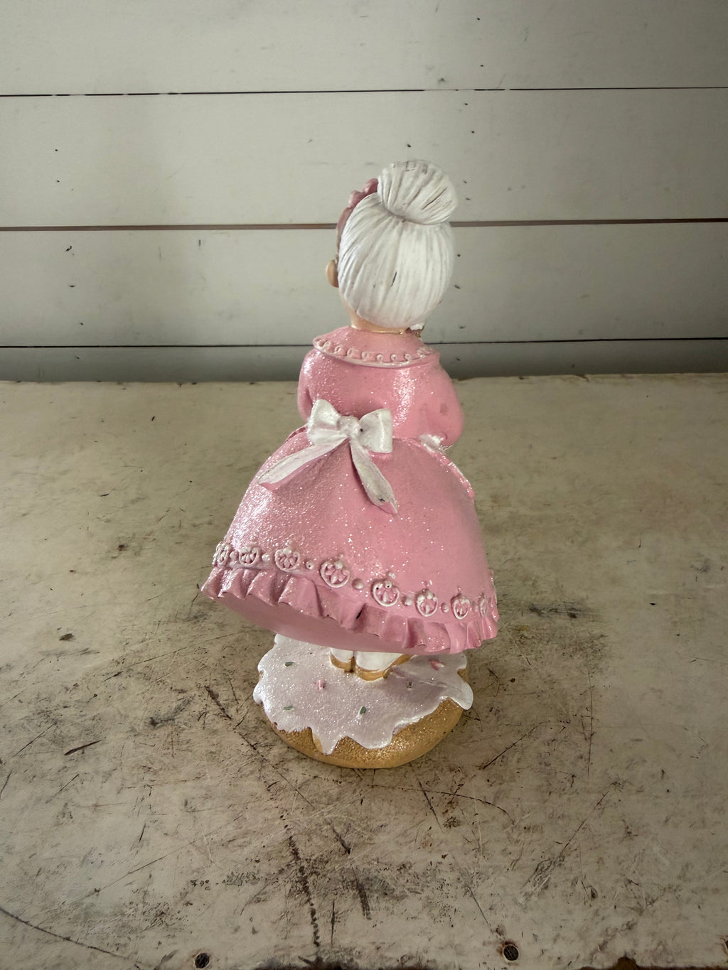 Mrs. Claus Holding Gingerbread House