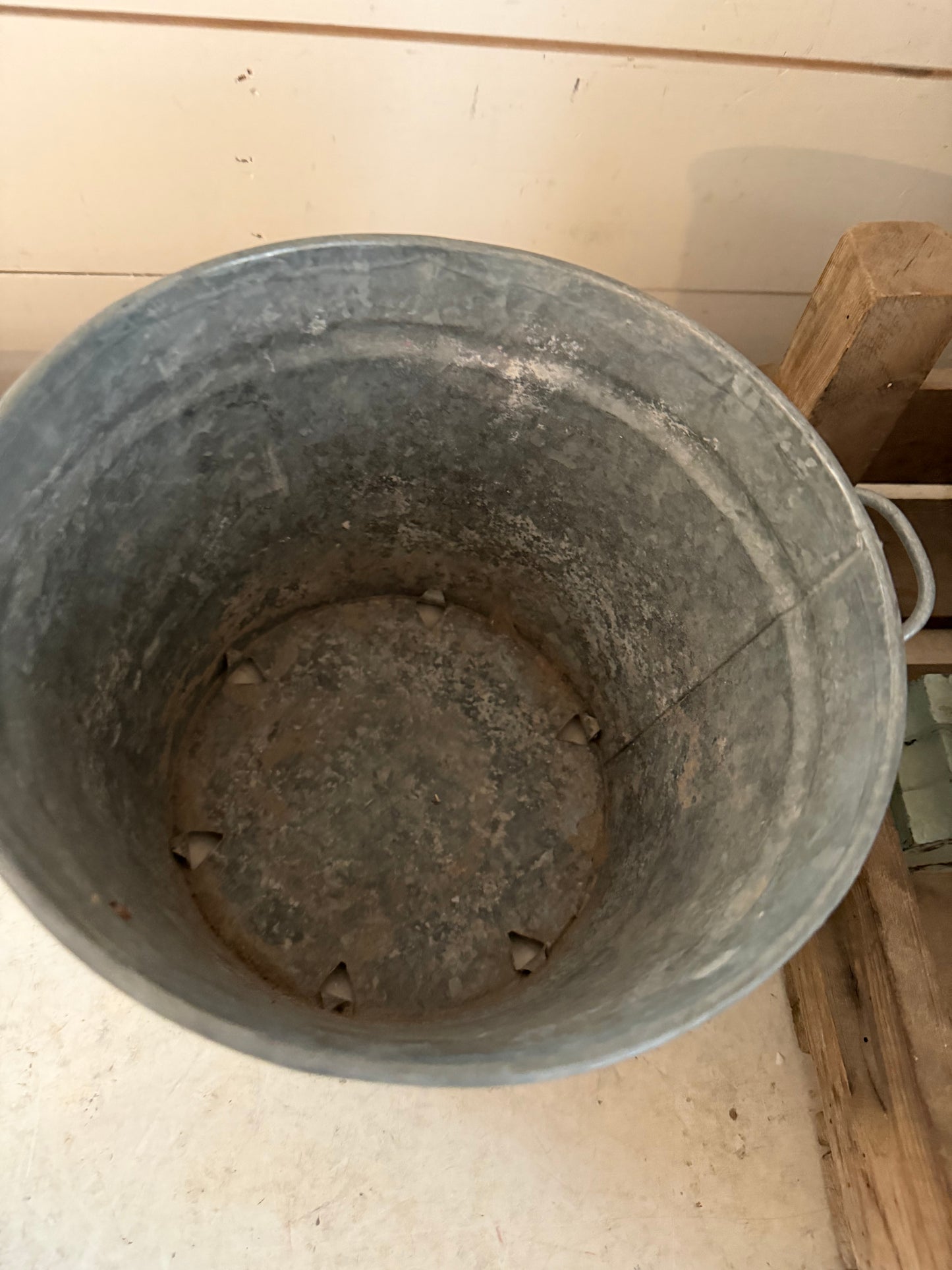 Galvanized bucket planter with holes