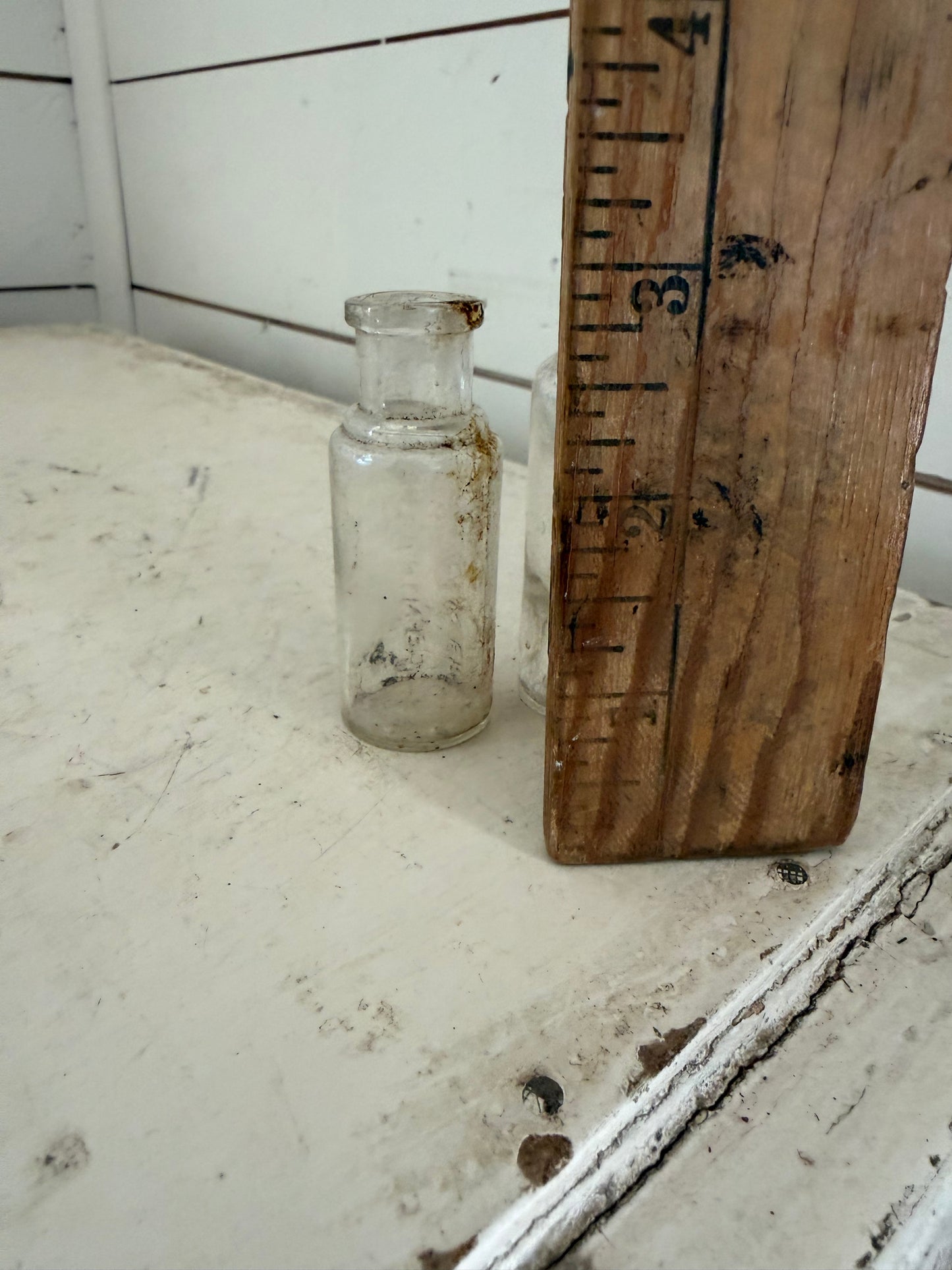 Set of two small glass antique bottles