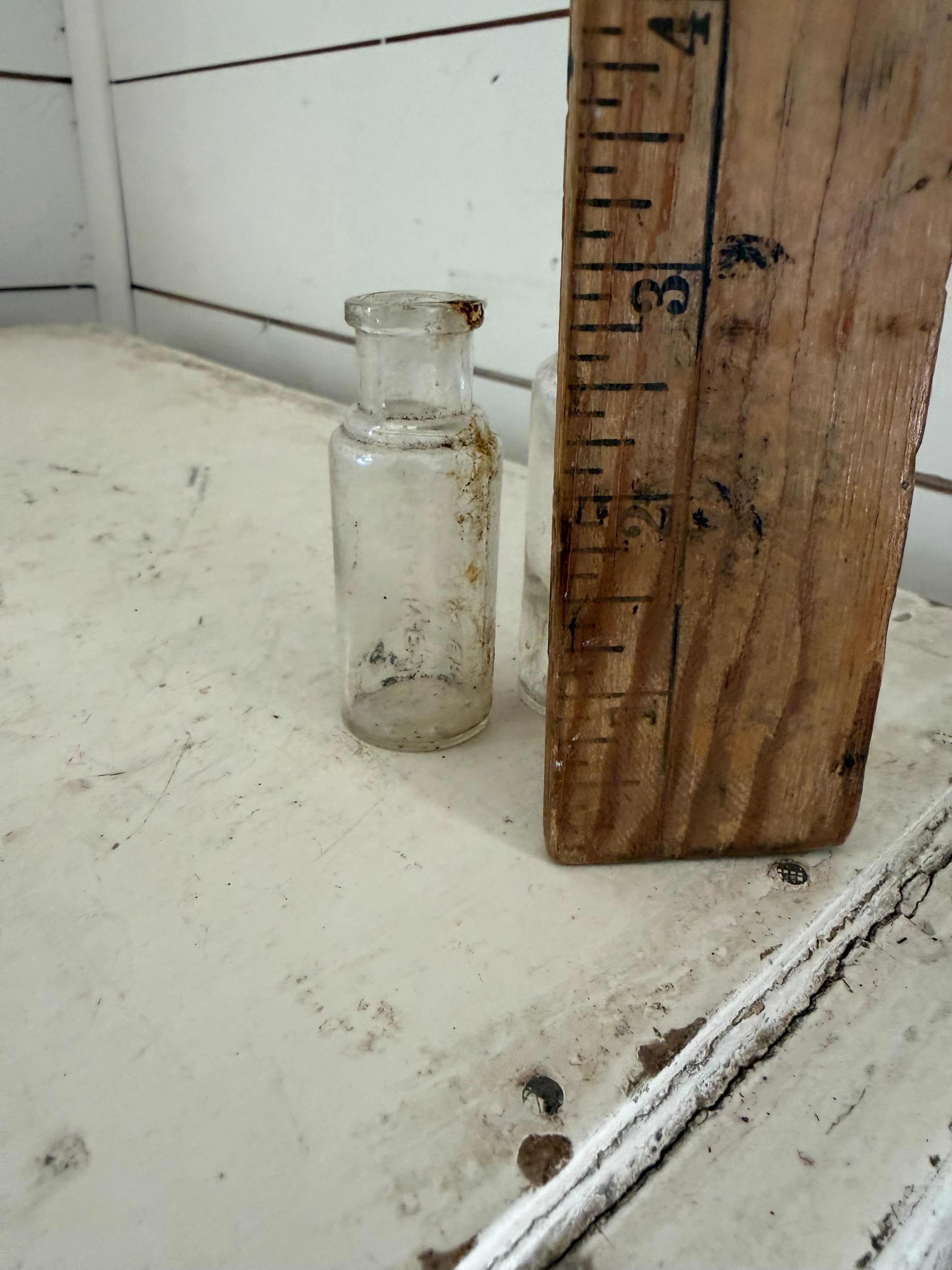 Set of two small glass antique bottles