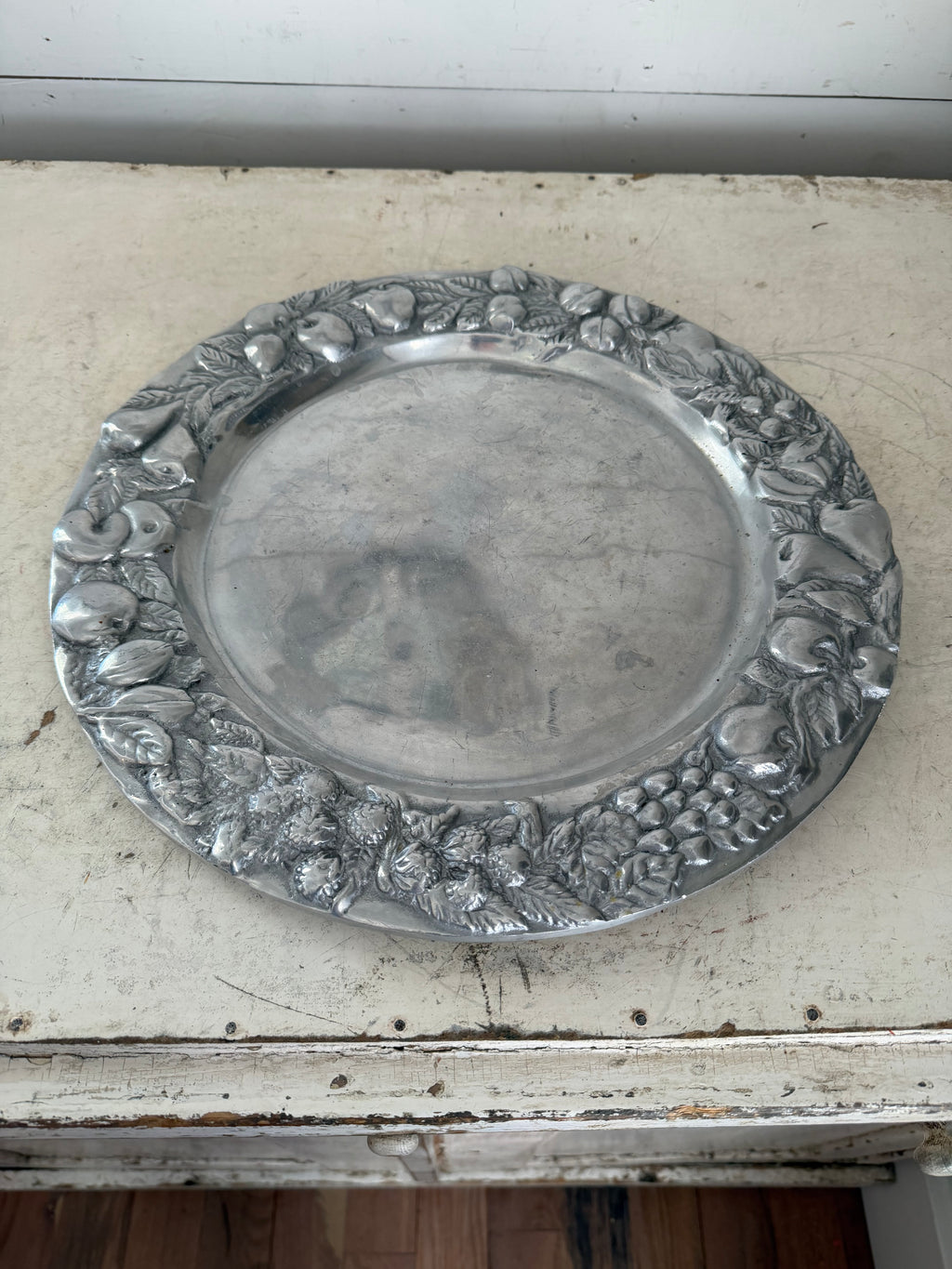 Mexican pewter / aluminum serving platter with a fruit and vine motif.