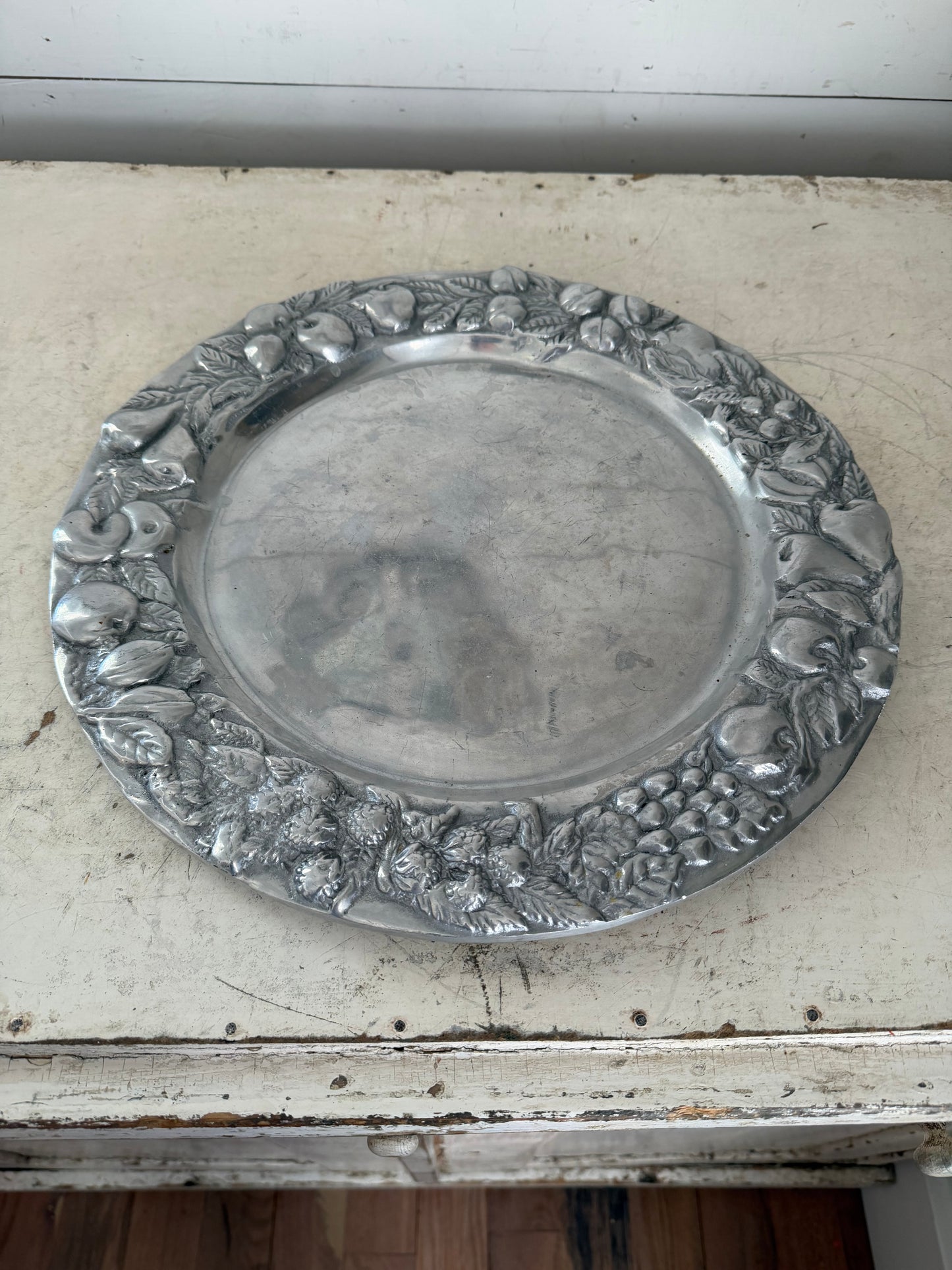 Mexican pewter / aluminum serving platter with a fruit and vine motif.