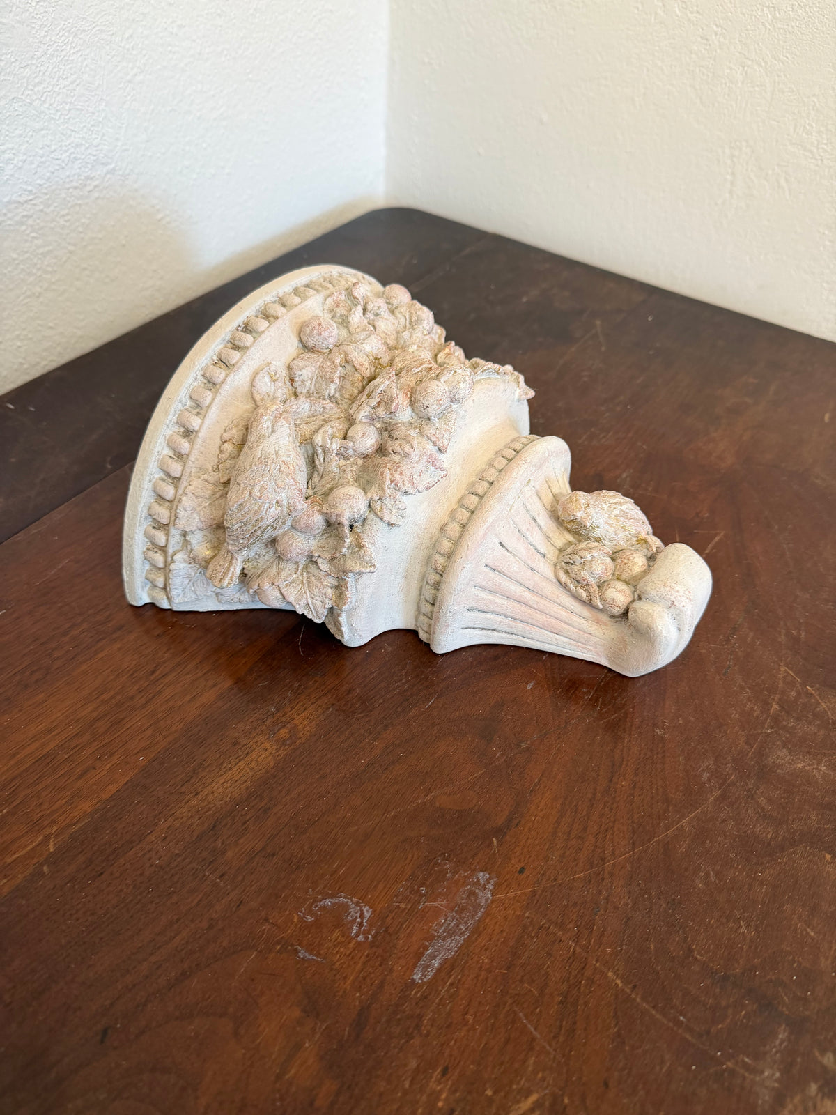 Plaster wall, sconces with flowers and birds will get makeover