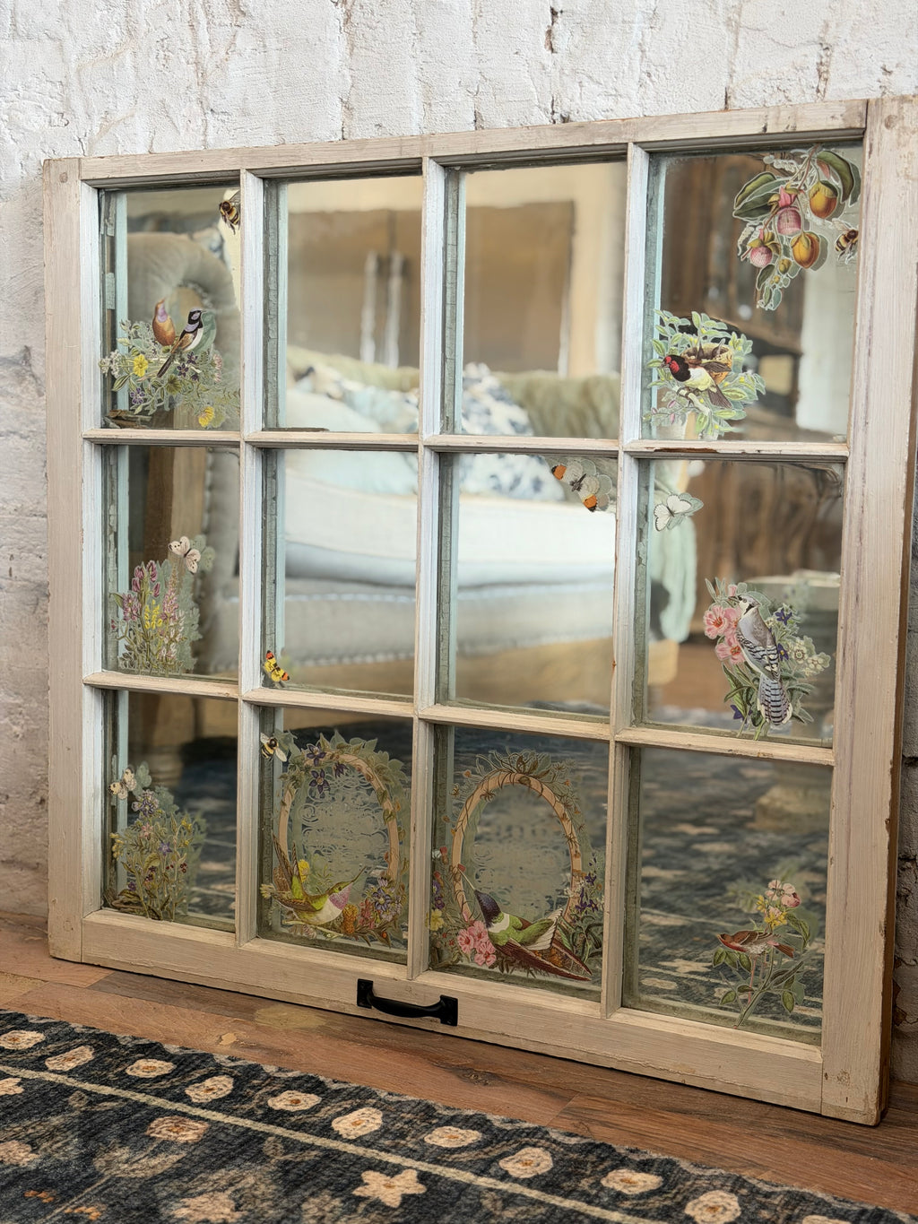 Window with old glass and mirror behind