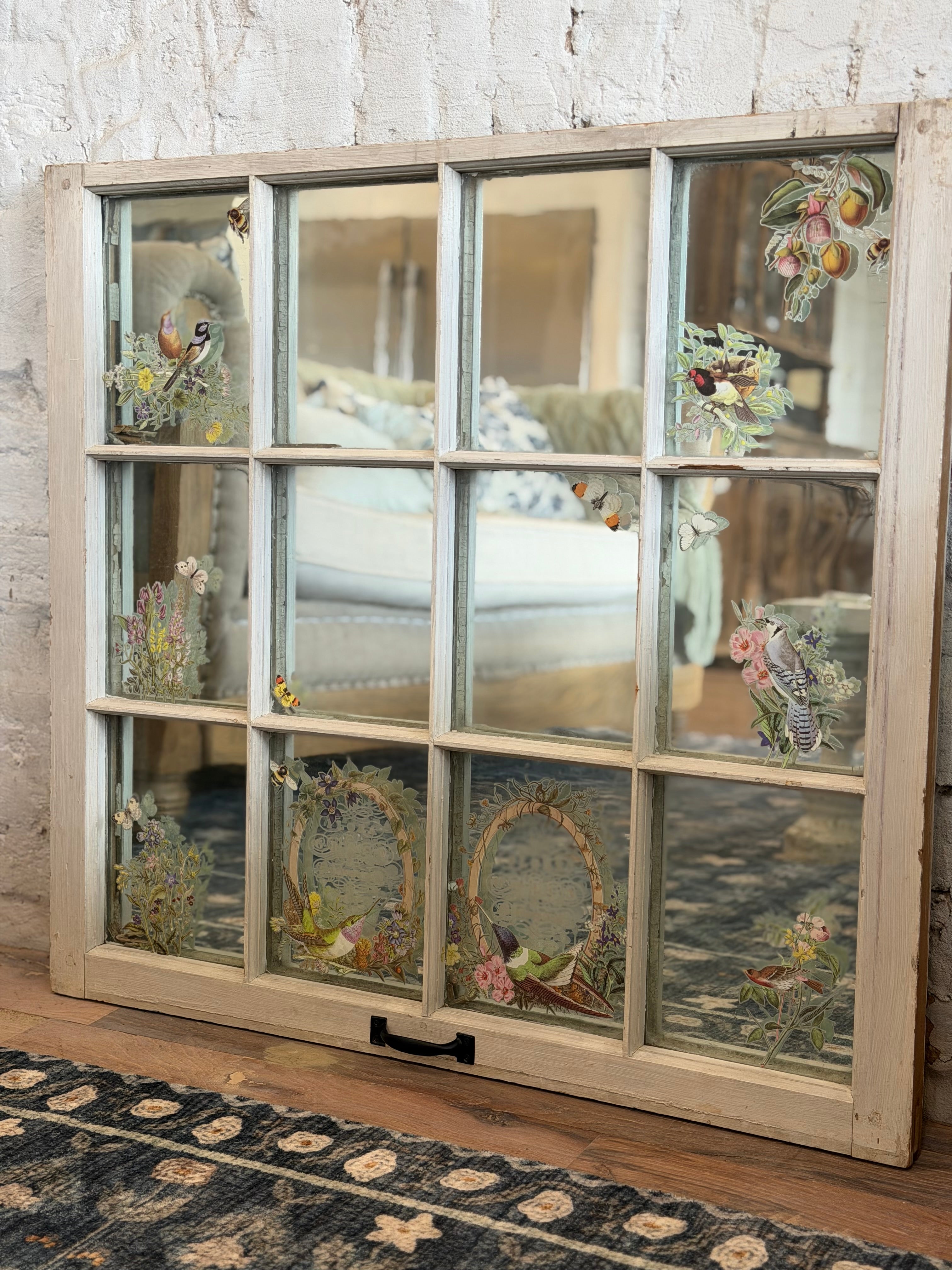 Window with old glass and mirror behind