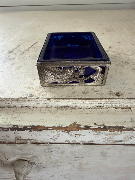 Vintage dragon themed trinket holder with cobalt blue glass insert