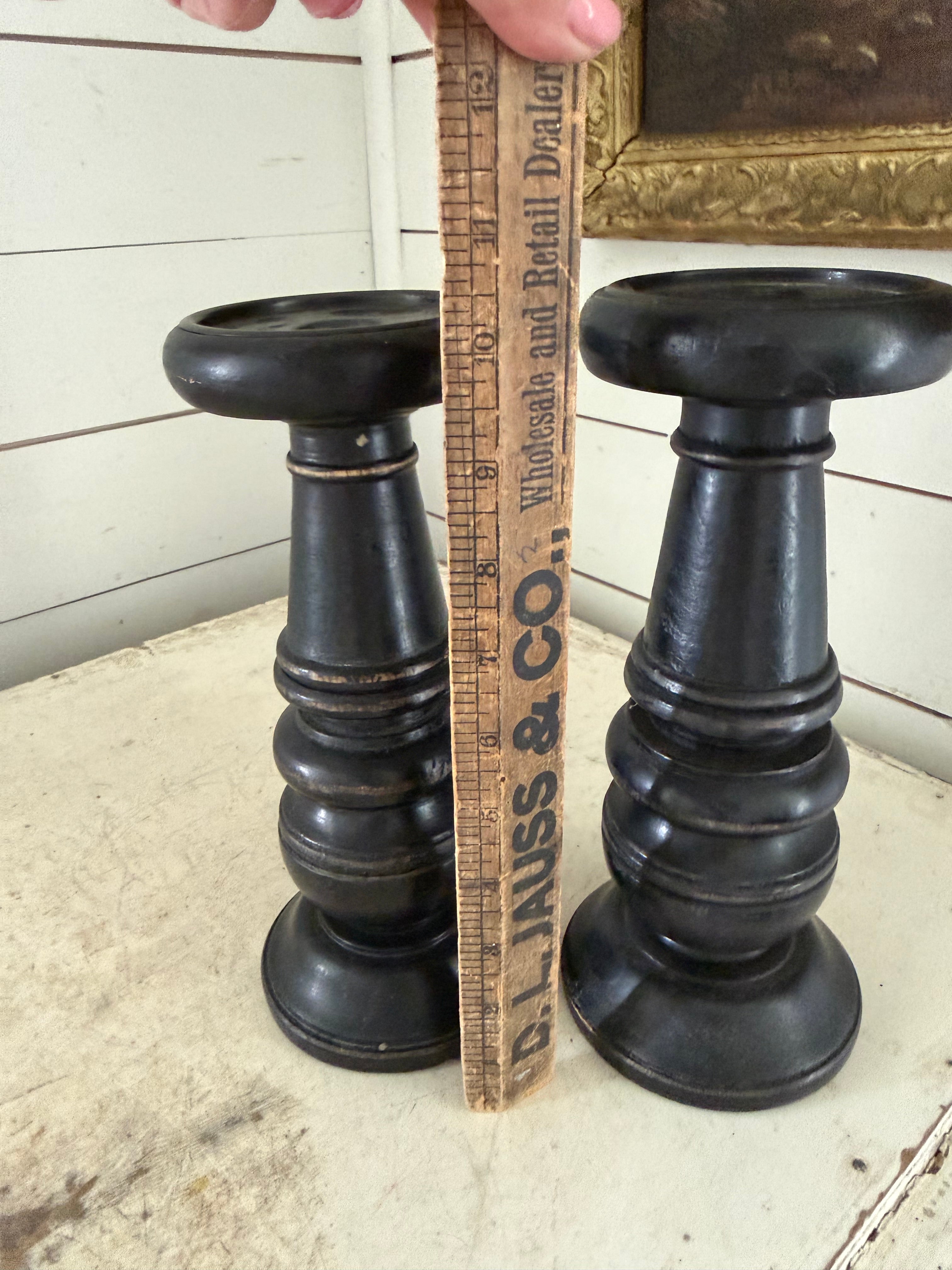 Set of black distress turned candlesticks