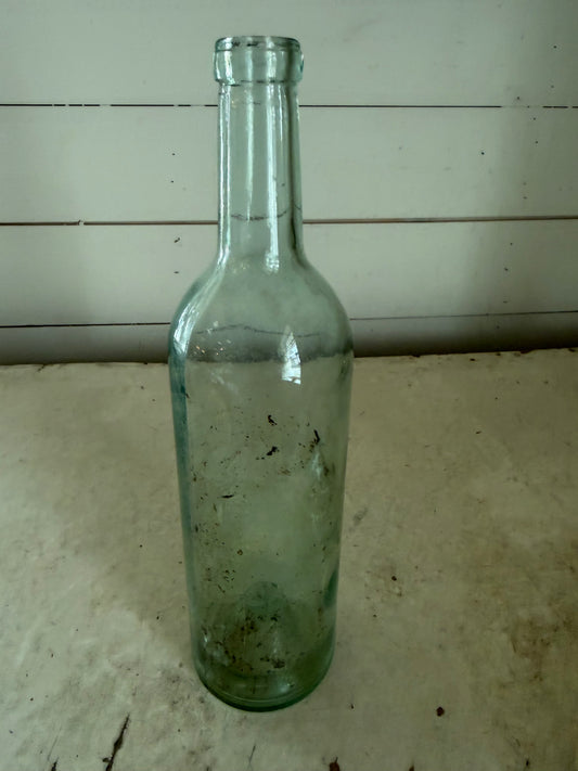 Early 20th Century Hand Blown Light Green Glass Bottle with dimpled bottom