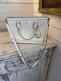 DKNY Hadlee small tote bag in a patent material with a removable shoulder strap has small scuffs