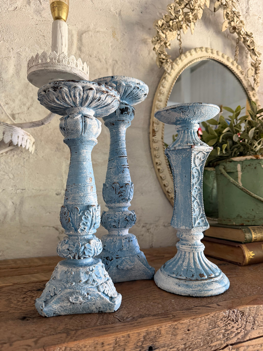 Set of three chippy French country candlesticks