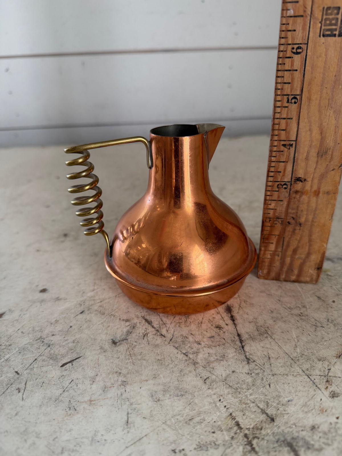 Vintage small copper pitcher with twisted brass handle