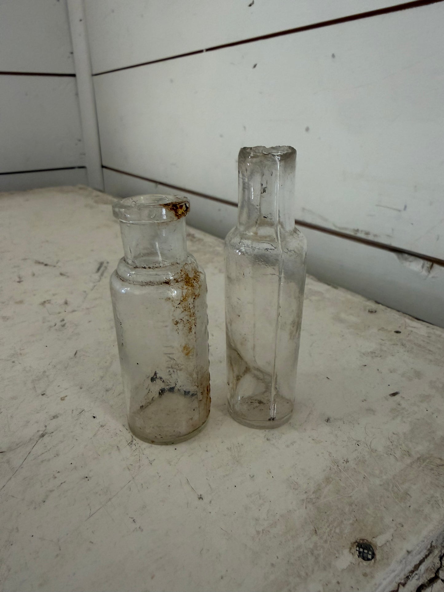 Set of two small glass antique bottles