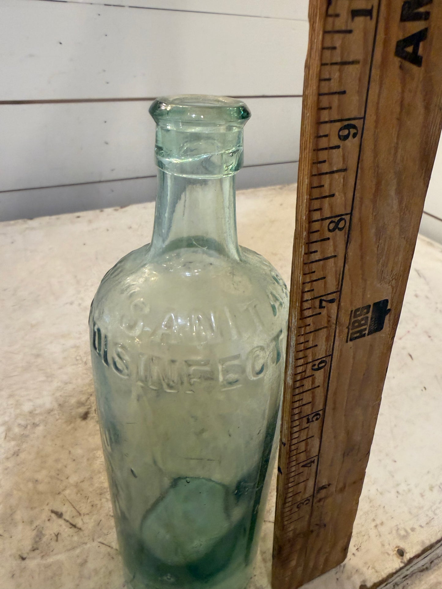 19th Century Sanitas Disinfectant aqua-colored bottle