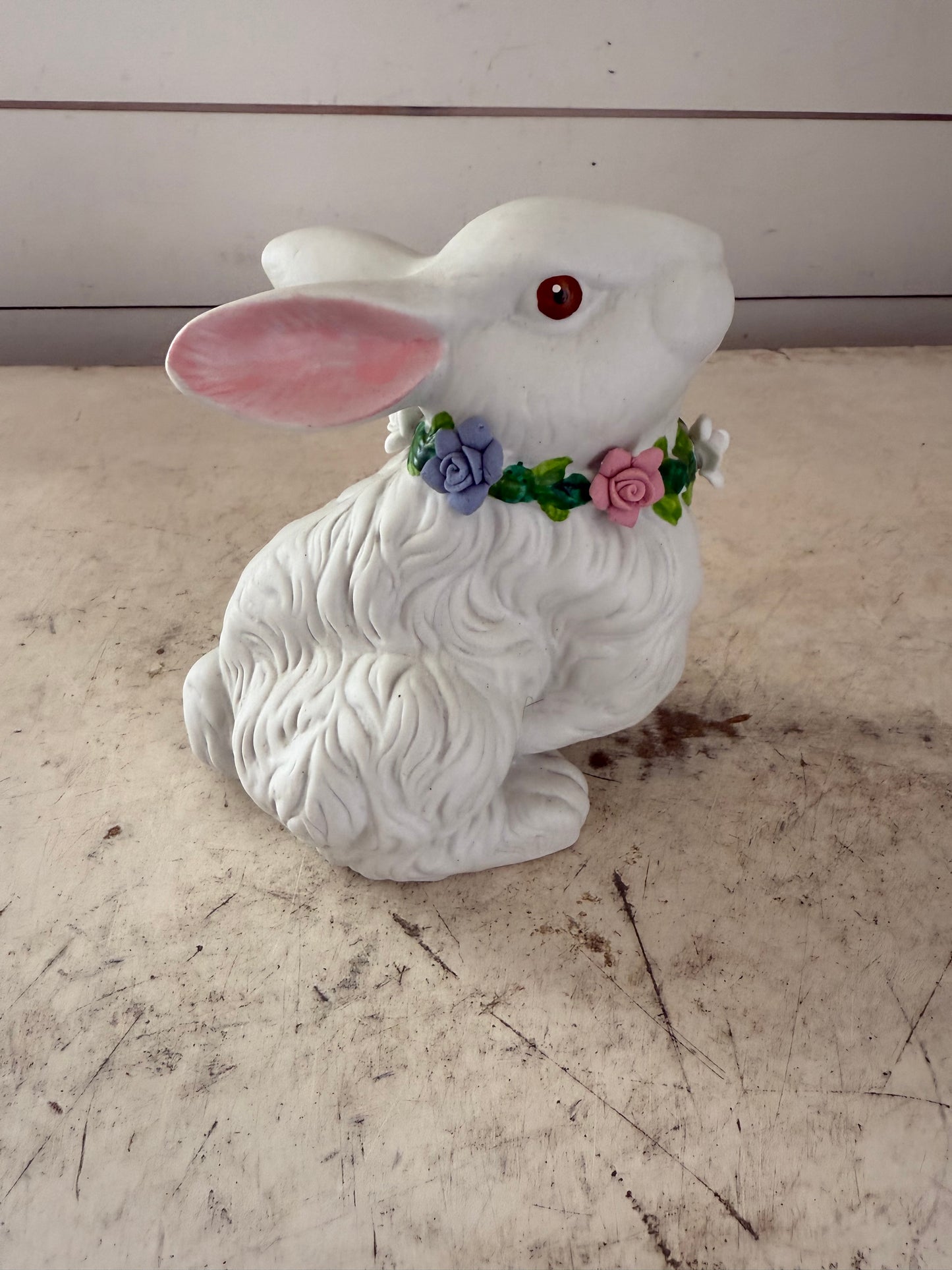 Vintage white rabbit statue with floral wreath  flowers have some chips