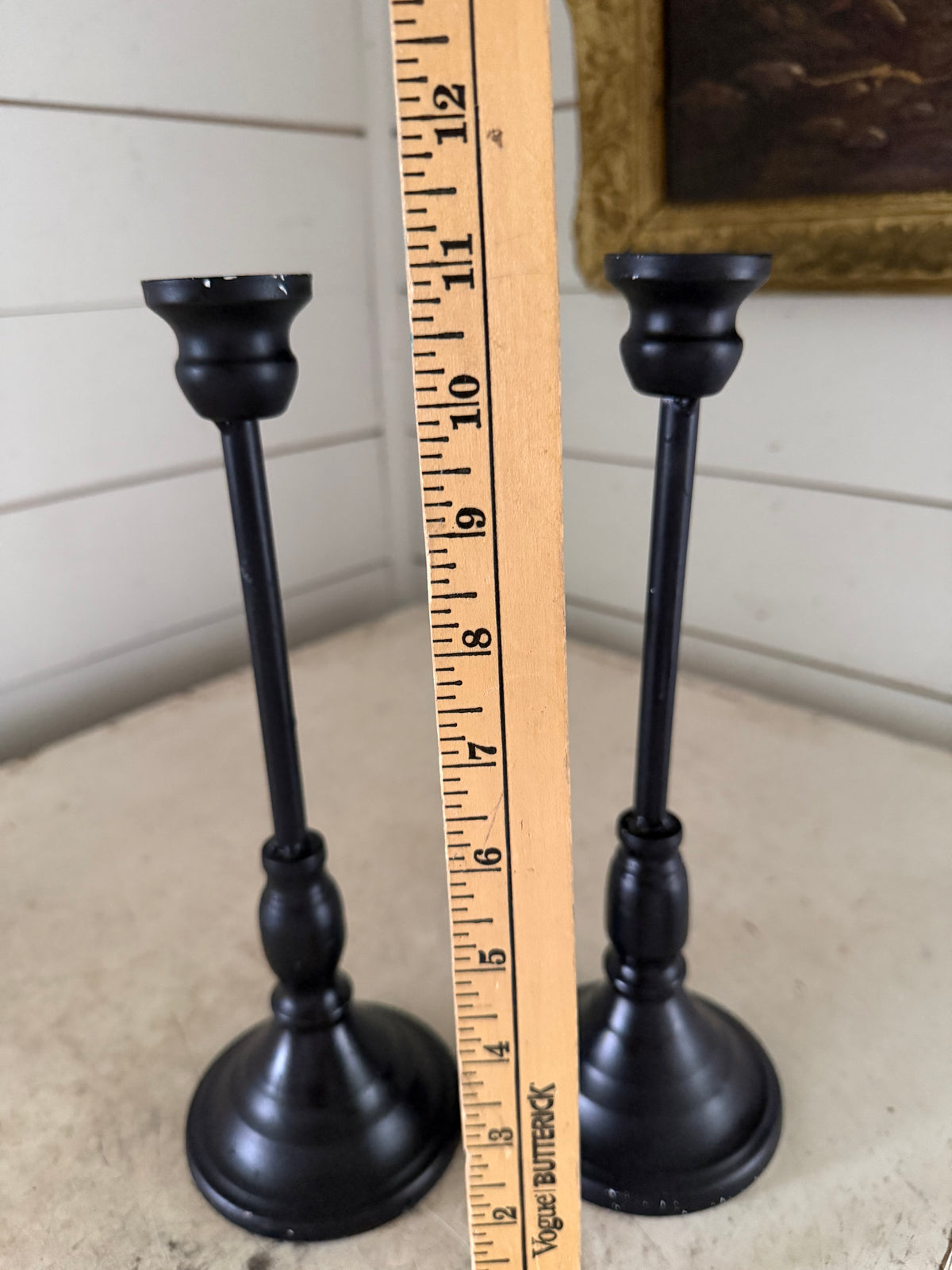 Set of black metal candlesticks