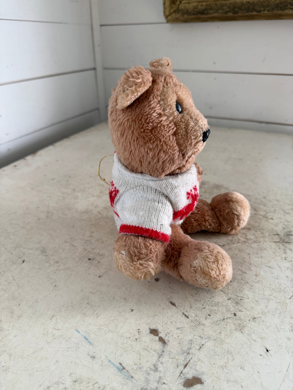 Vintage teddy bear with reindeer sweater
