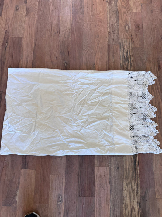 Vintage pillow case with embroidered edge