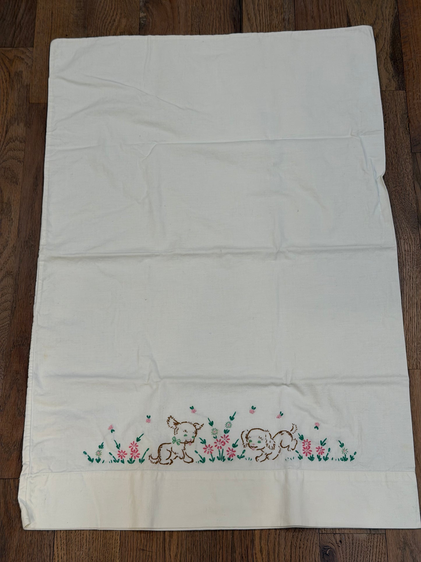 Puppies playing in flowers embroidered pillowcase