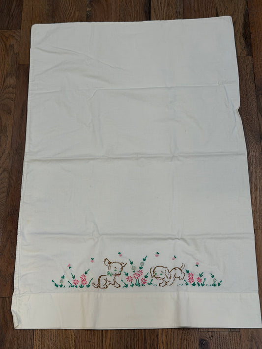 Puppies playing in flowers embroidered pillowcase