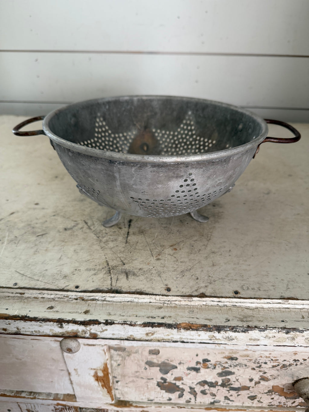 Vintage aluminum star pattern colander