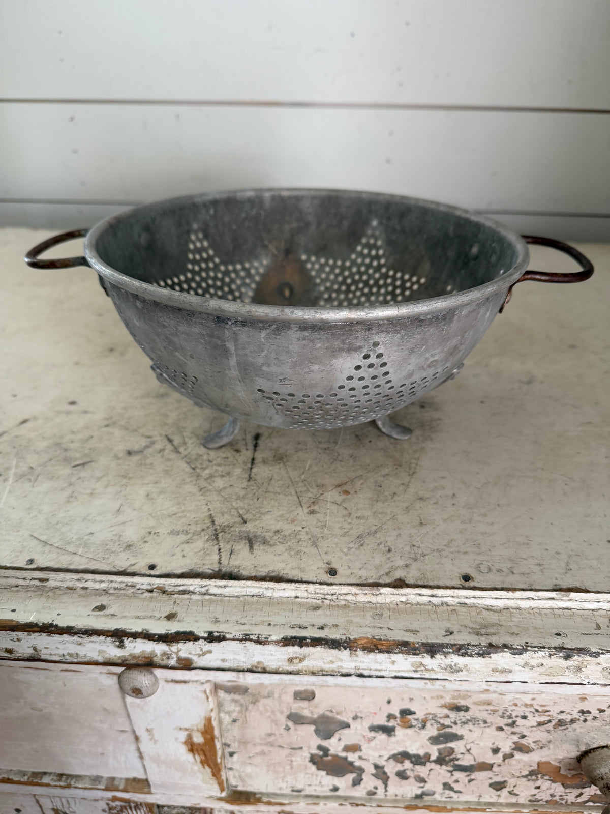 Vintage aluminum star pattern colander