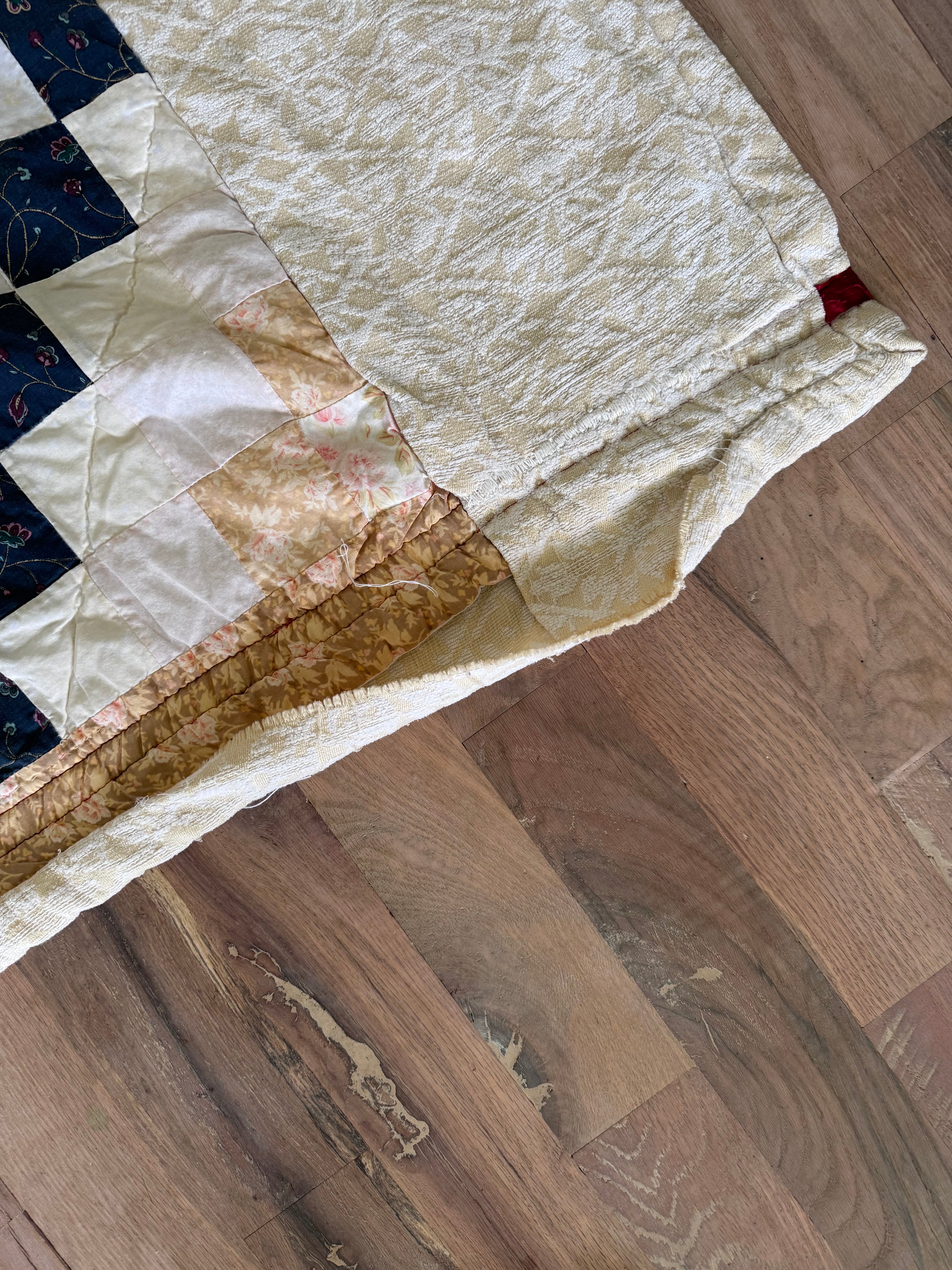 Hand made quilt with diamond pattern - has rips