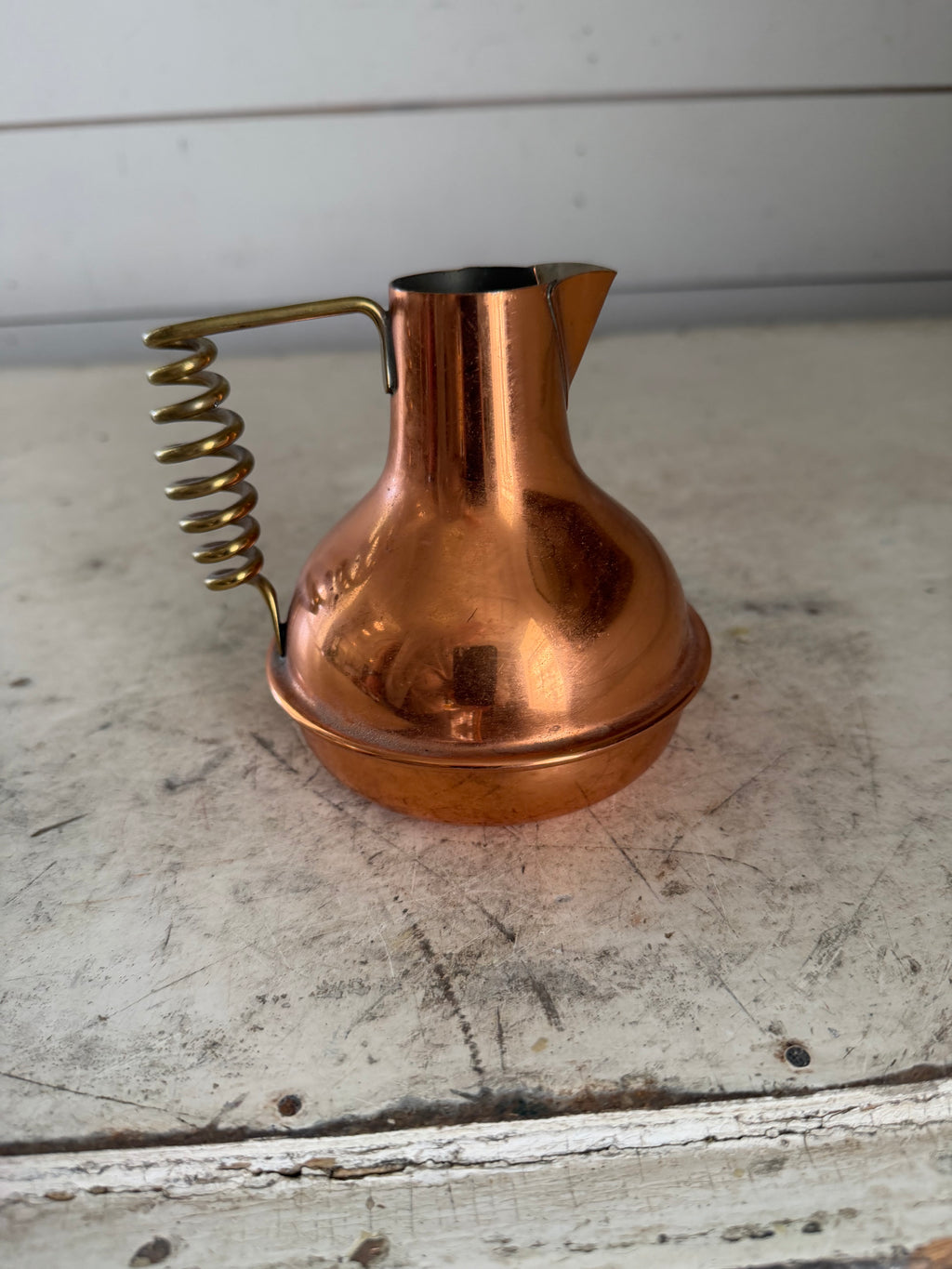 Vintage small copper pitcher with twisted brass handle