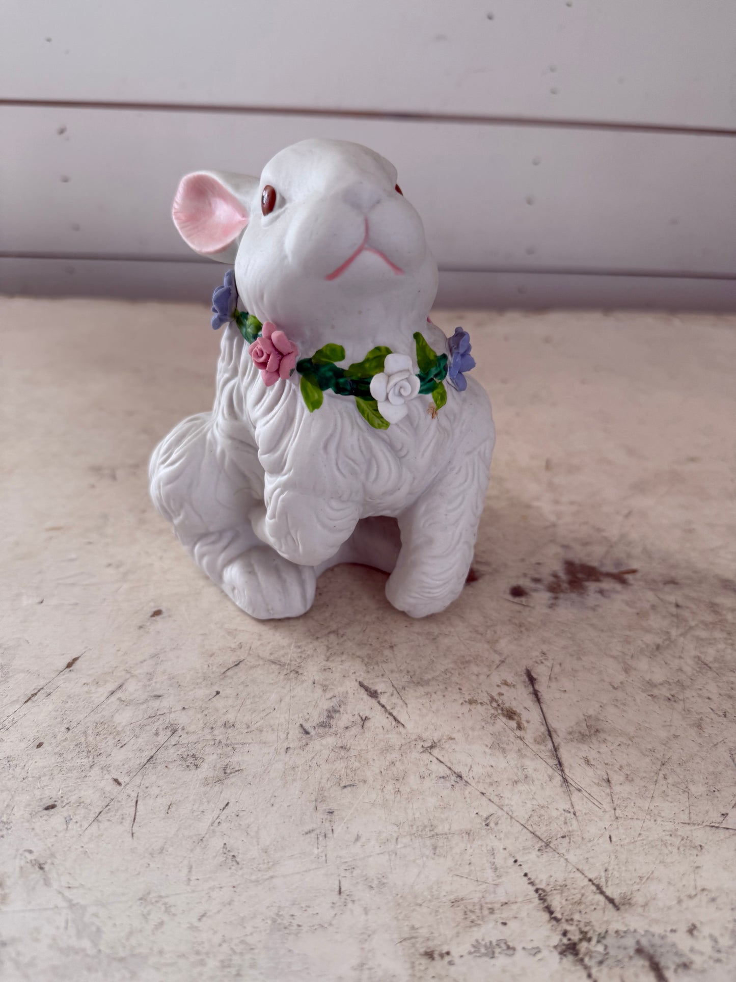 Vintage white rabbit statue with floral wreath  flowers have some chips