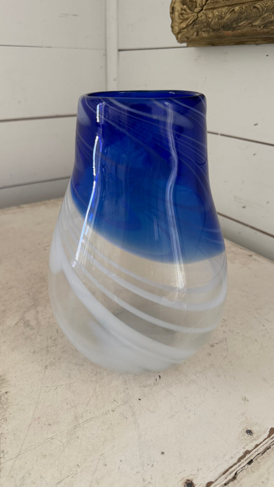 vintage studio hand-blown art glass vase featuring a striking cobalt blue top half that gradients into a clear base wrapped in opaque white swirls