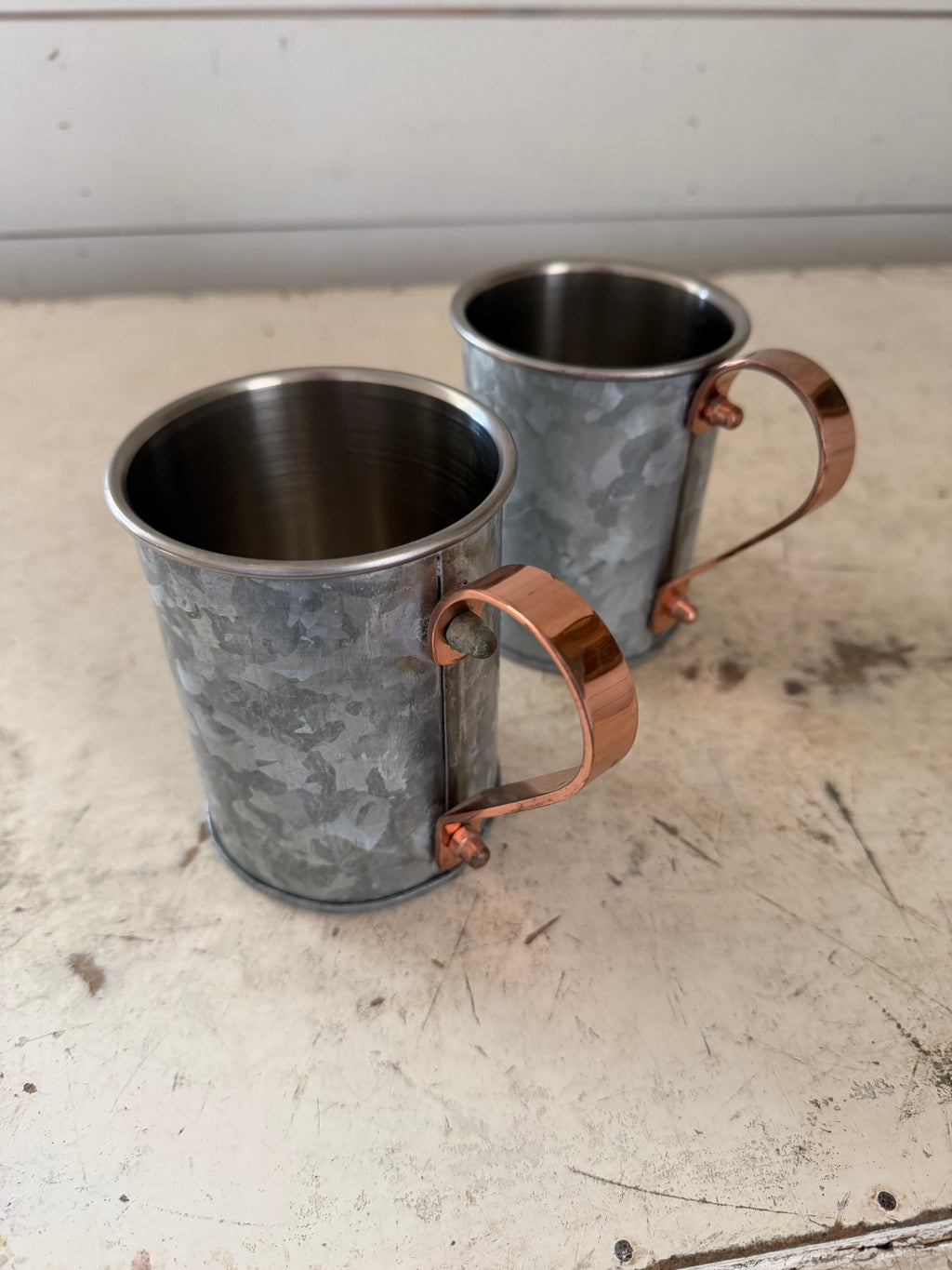 Weighted cup with copper handle